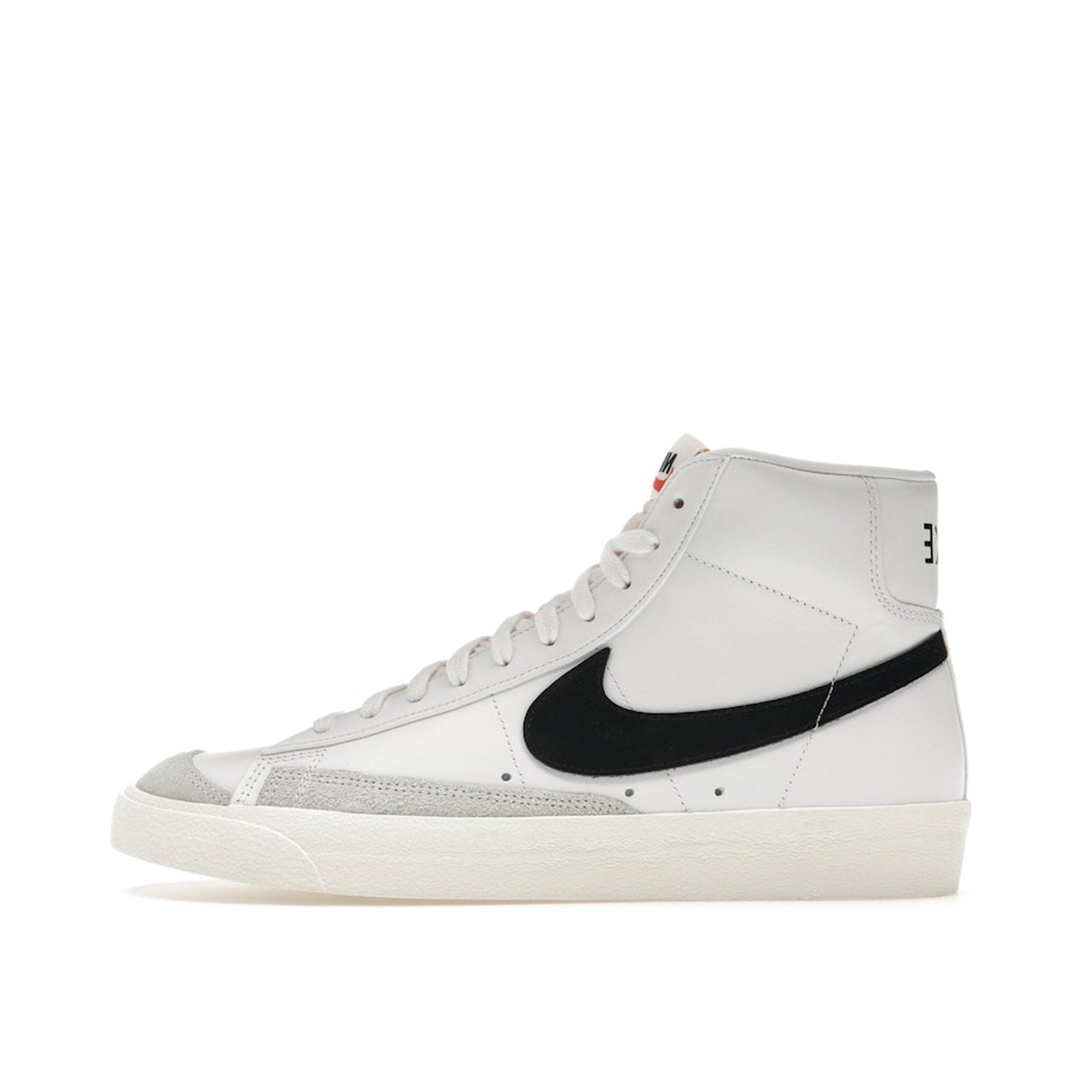 Nike Blazer Mid ’77 Vintage sneakers, side view, in white with black swoosh.