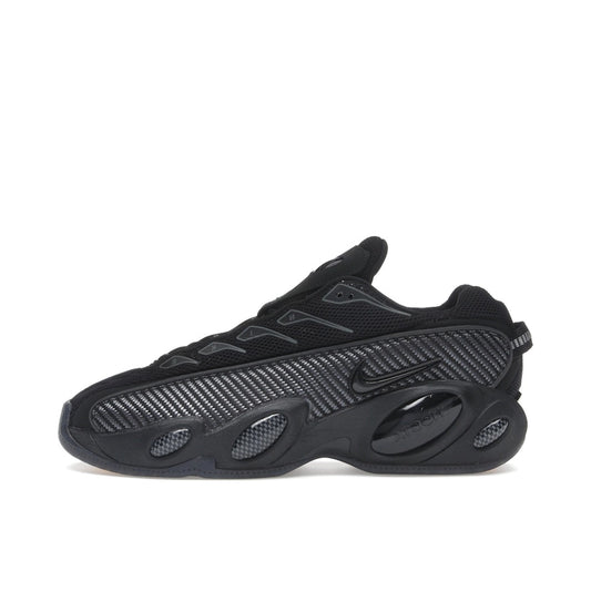Nike NOCTA Glide Black Iron Grey, side view, athletic silhouette with signature NOCTA styling.