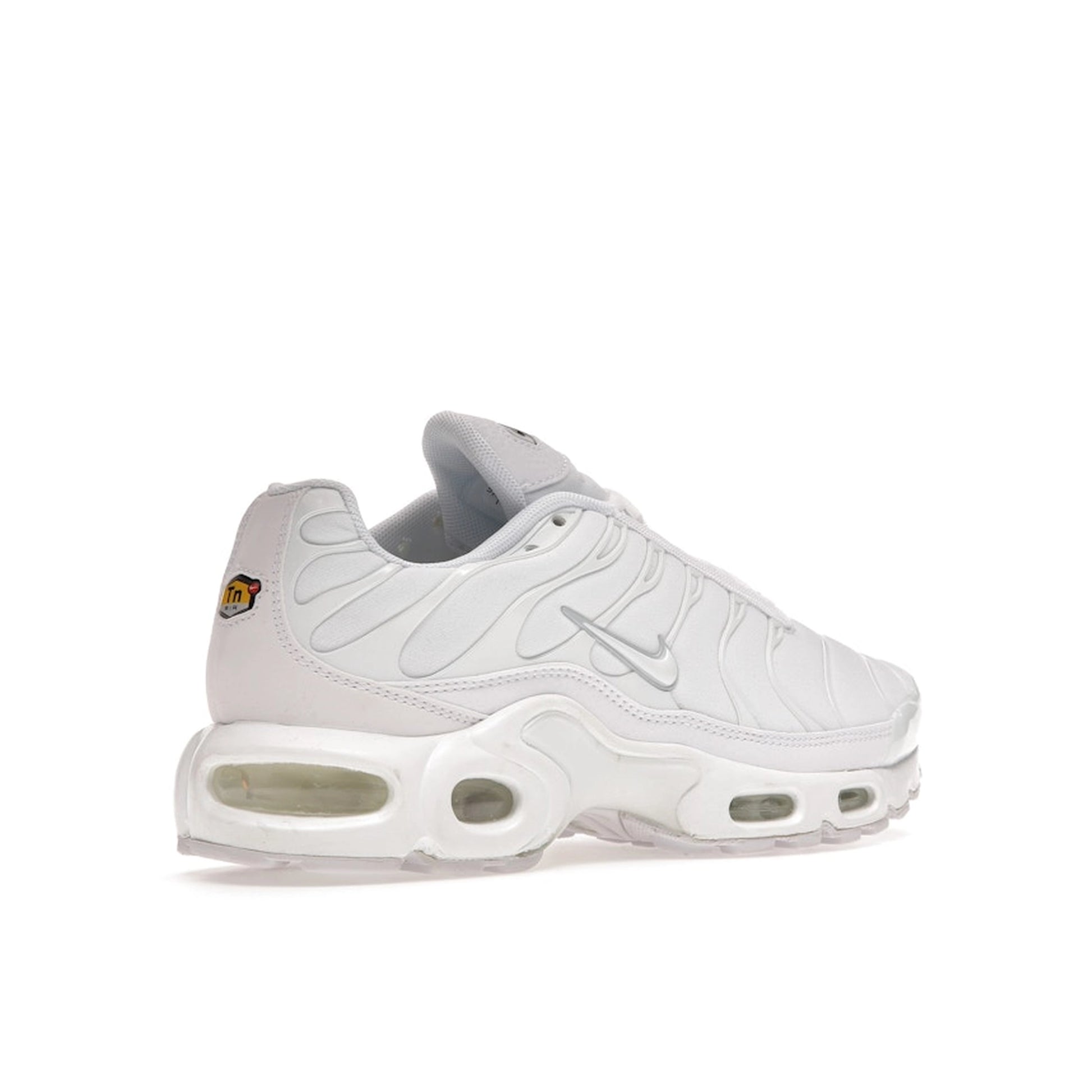 Nike Air Max Plus sneakers, back view, in all-white triple white colorway.