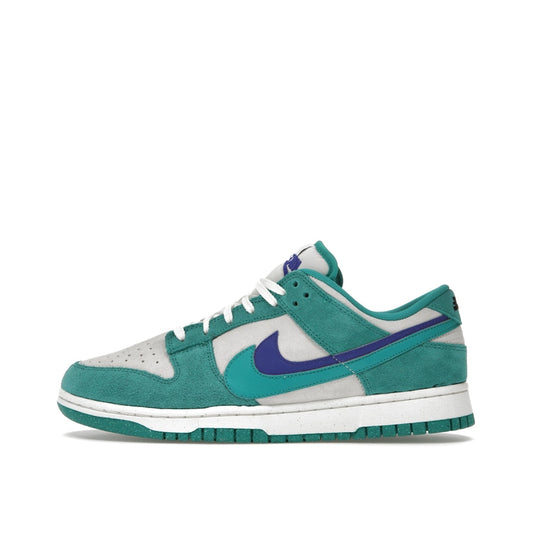 Nike Dunk Low SE '85 Women's sneakers, side view, model DO9457-101 in Neptune green with white and grey details.