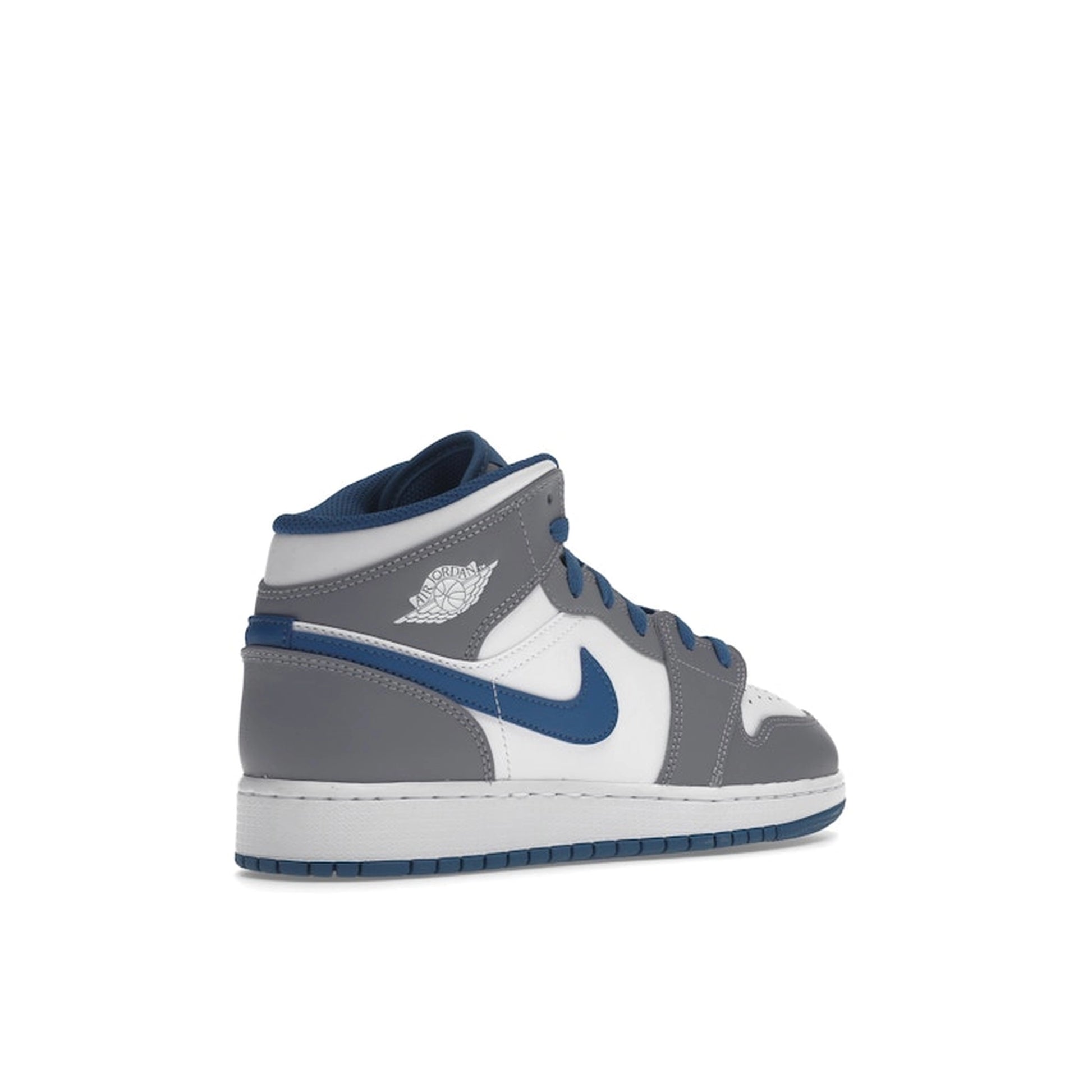 Jordan 1 Mid GS sneakers, back view, in true blue with cement grey and white accents.