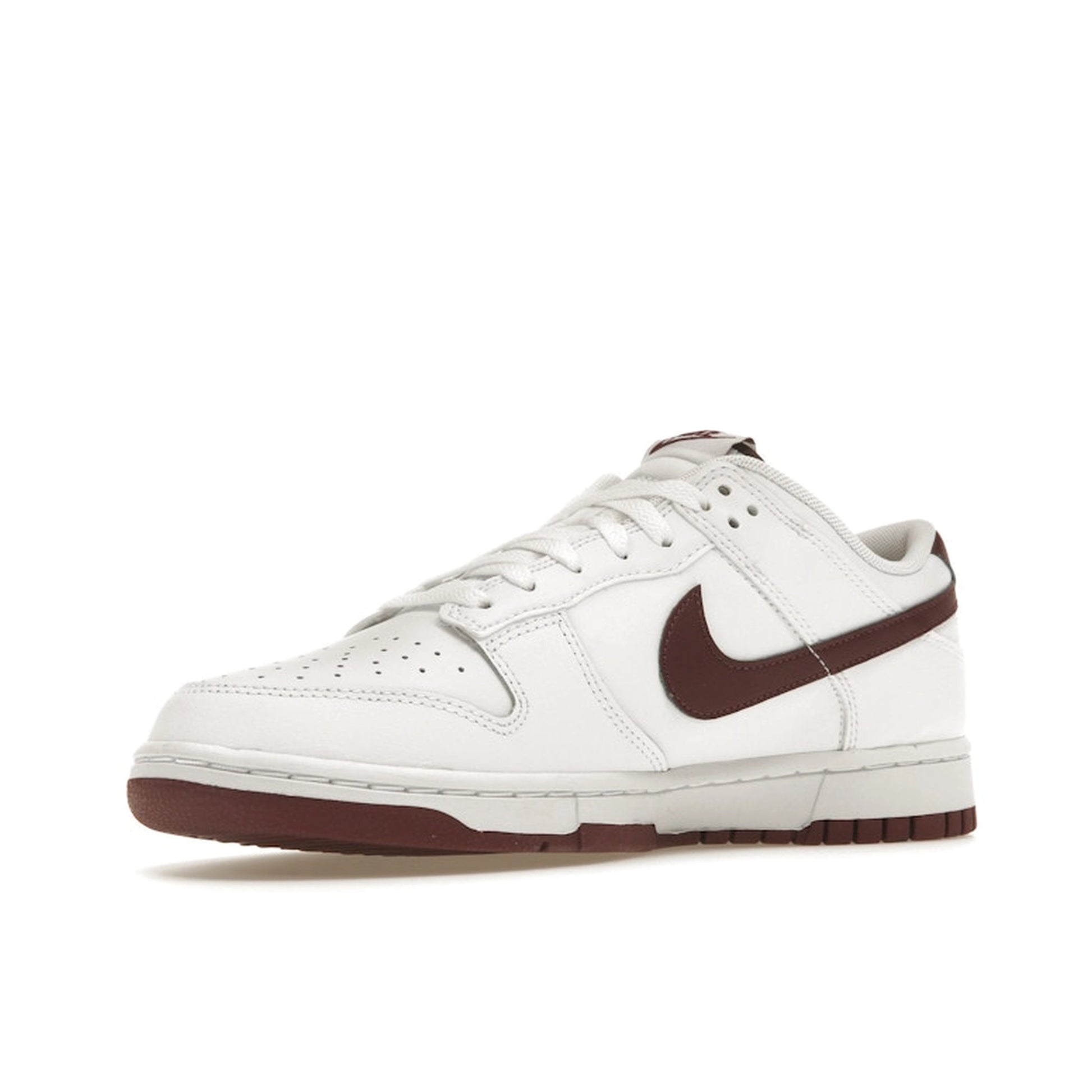Nike Dunk Low Retro sneakers, front view, in white with night maroon overlays.