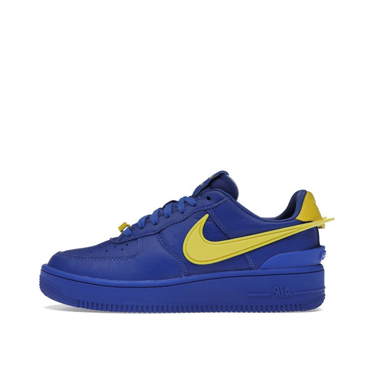 Nike Air Force 1 Low SP Ambush sneakers, side view, model DV3464-400, in game royal with yellow swoosh.