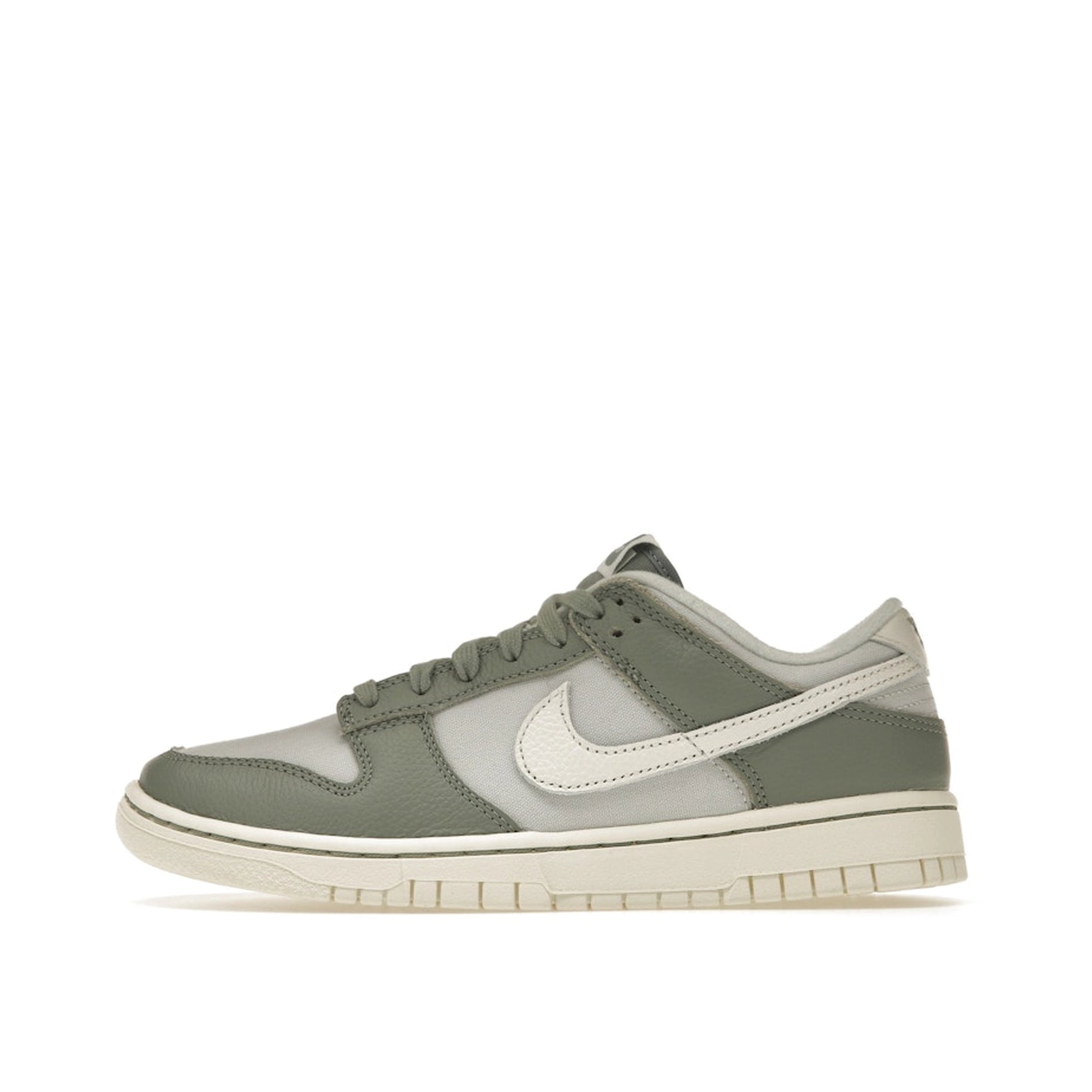 Nike Dunk Low sneakers, side view, model DV7212-300 in mica green with white and grey details.