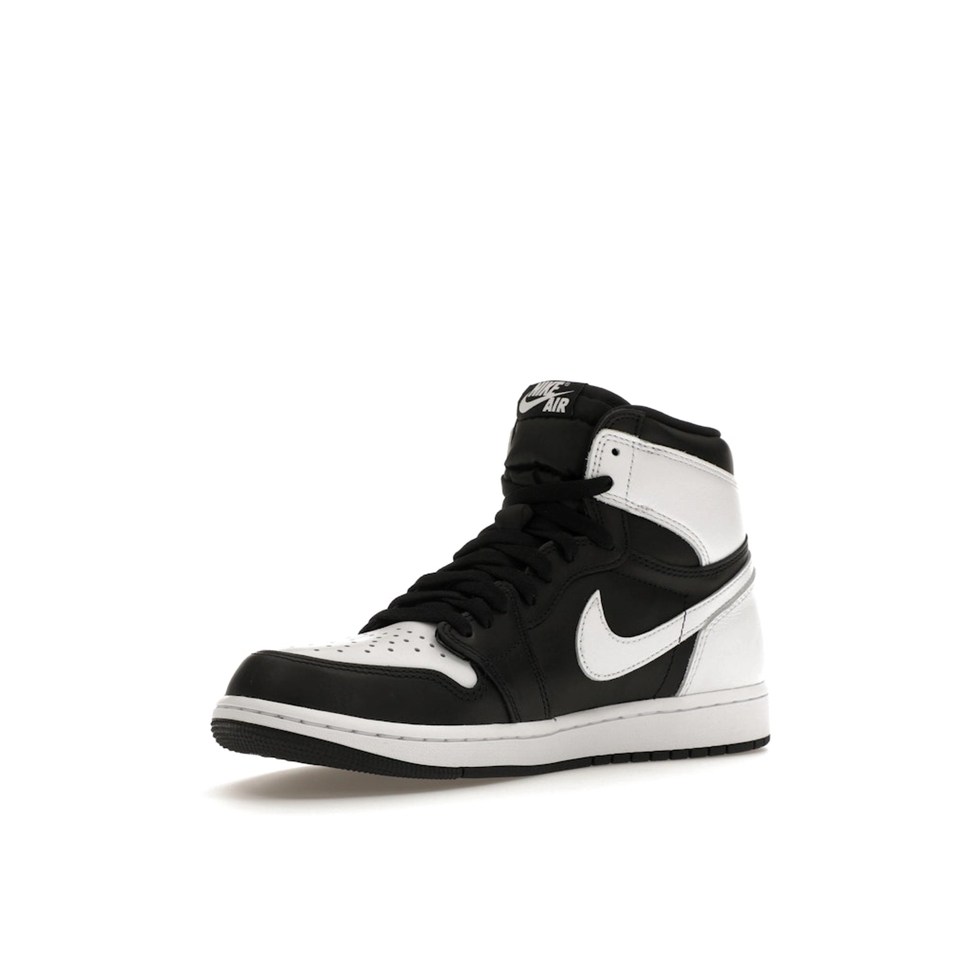 Jordan 1 Retro High OG sneakers, front view, model DZ5485-010, in black and white with classic styling.