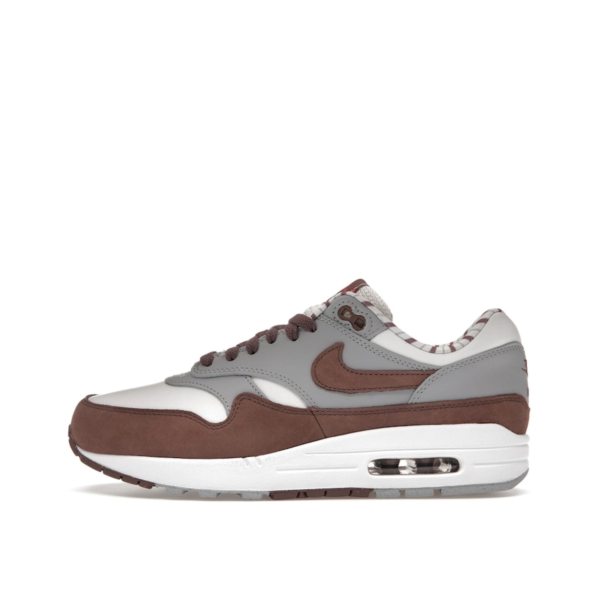 Nike Air Max 1 Premium Shima Shima 2023 sneakers, side view, model FB8916-100, brown with white and grey accents.