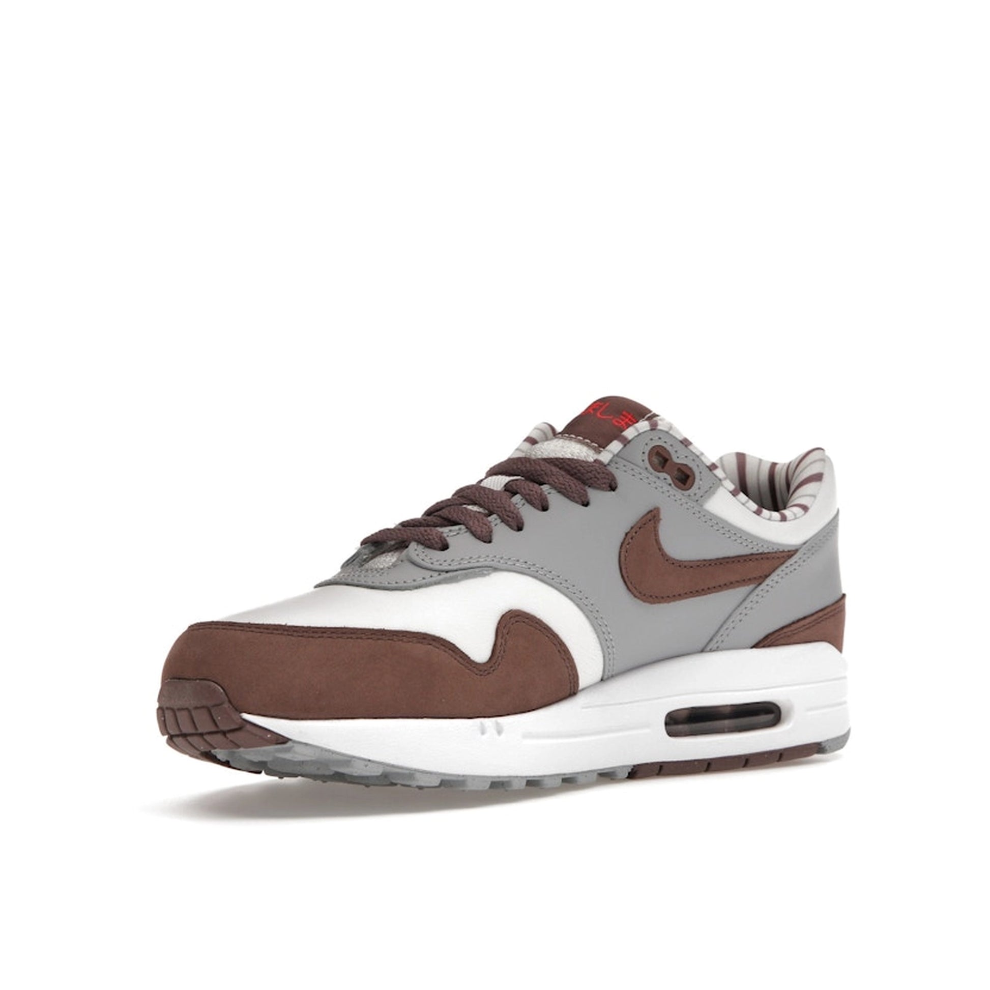 Nike Air Max 1 Premium Shima Shima 2023 sneakers, front view, model FB8916-100, brown with white and grey accents.