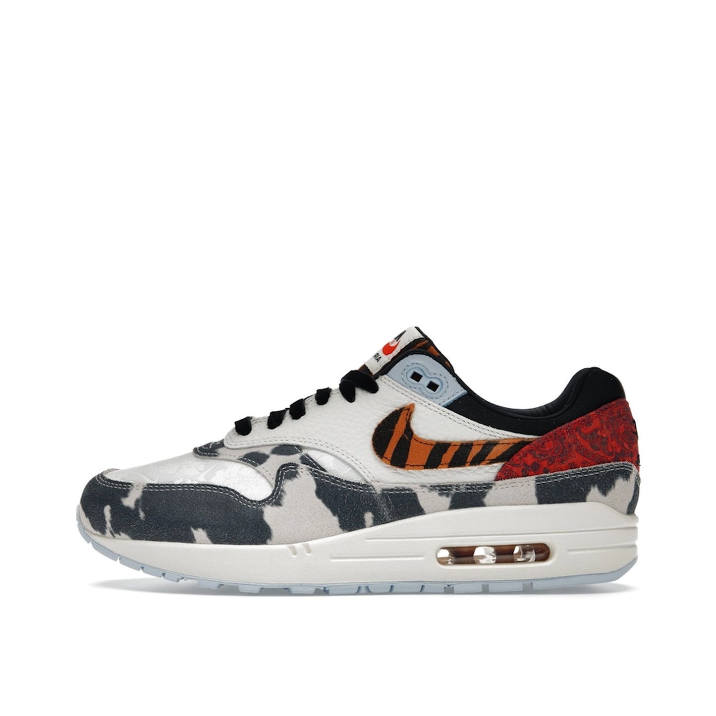 Nike Air Max 1 '87 Great Indoors Women's sneakers, side view, model FD0827-133, in cream with animal print details.