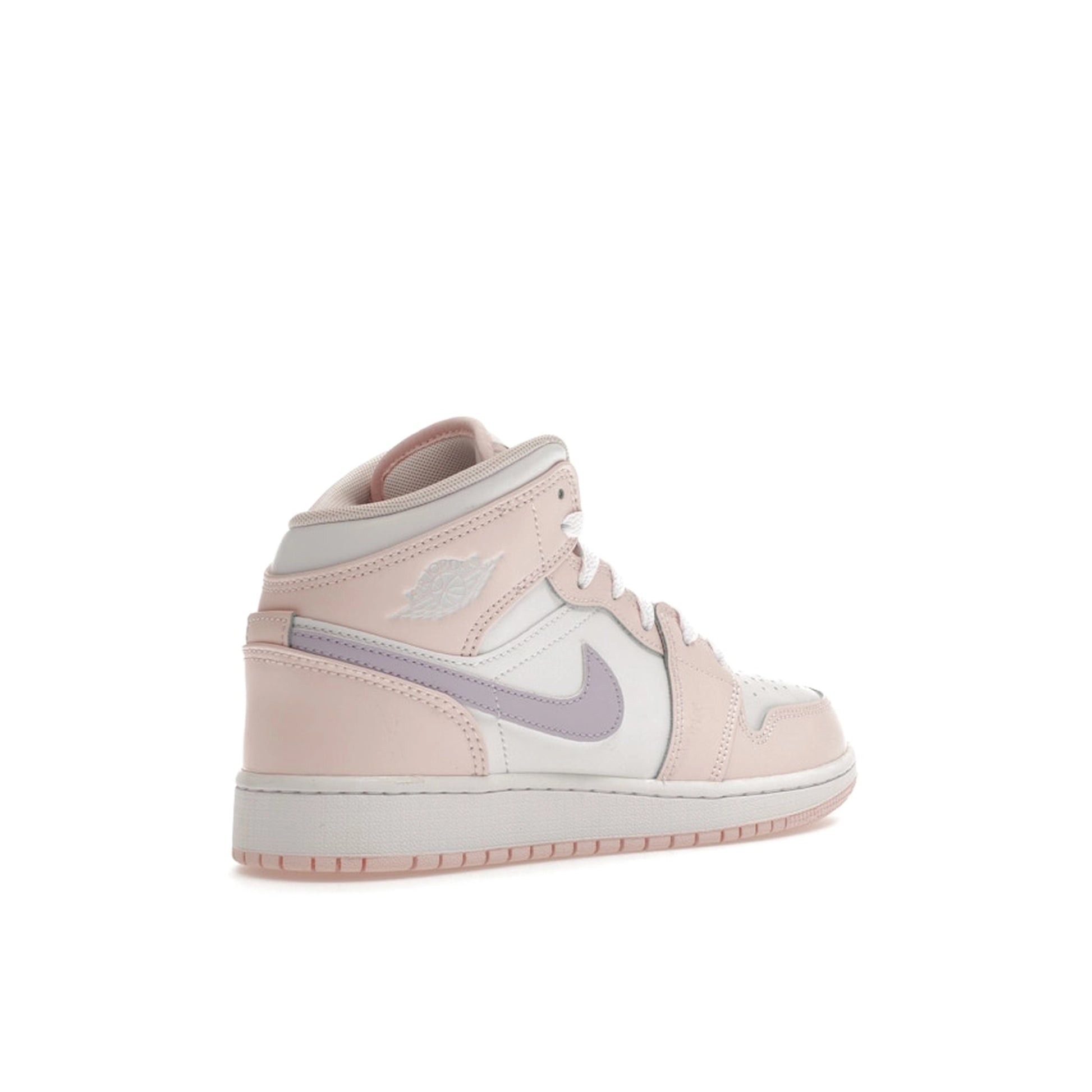 Jordan 1 Mid GS sneakers, back view, in pink wash with white accents.