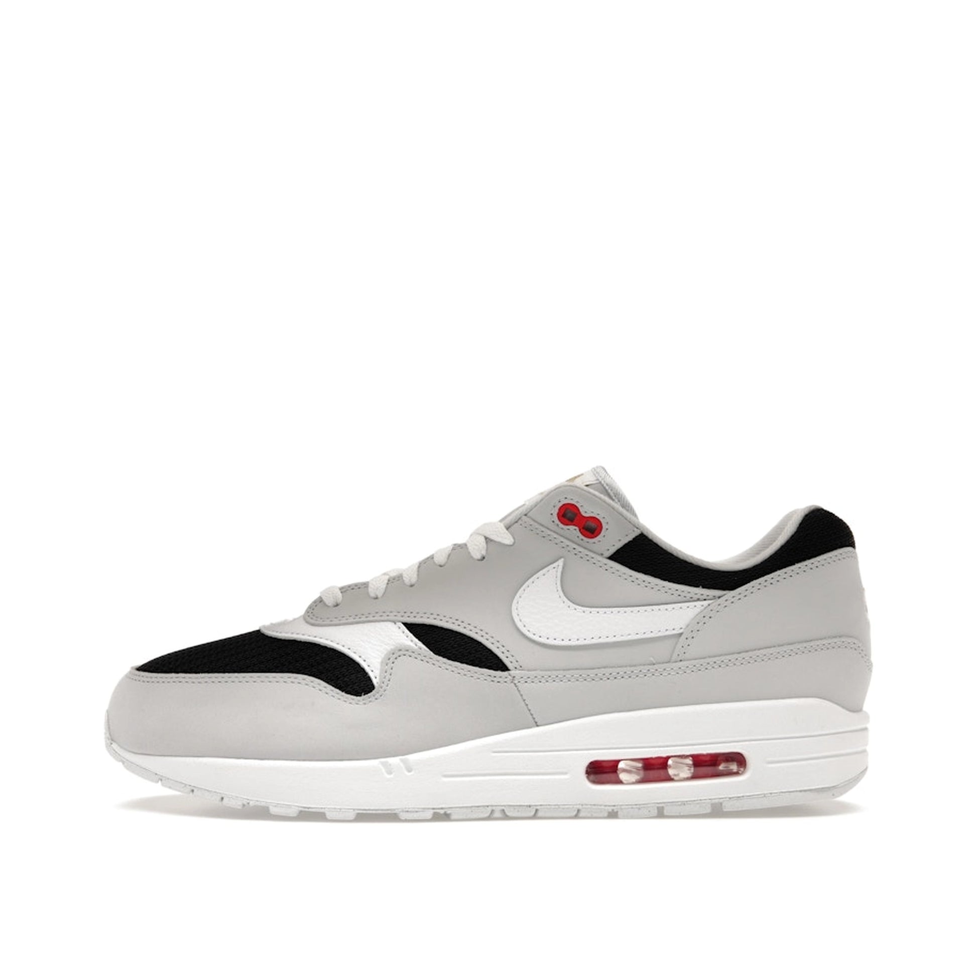 Nike Air Max 1 Urawa 2023 sneakers, side view, model FD9081-001 in grey, black and red details.