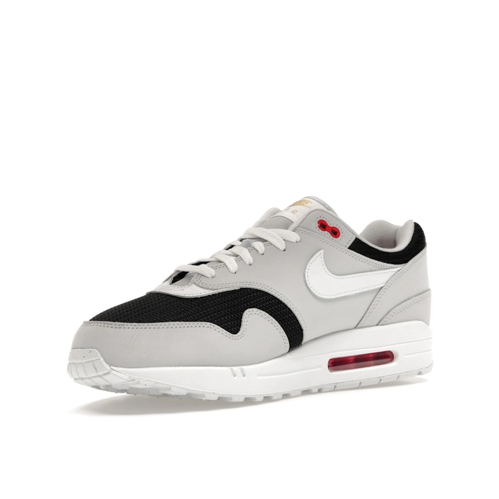 Nike Air Max 1 Urawa 2023 sneakers, front view, model FD9081-001 in grey, black and red details.