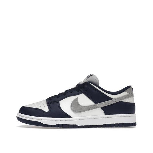 Nike Dunk Low Summit White Midnight Navy sneakers, side view, model FD9749-400 in white with navy accents.