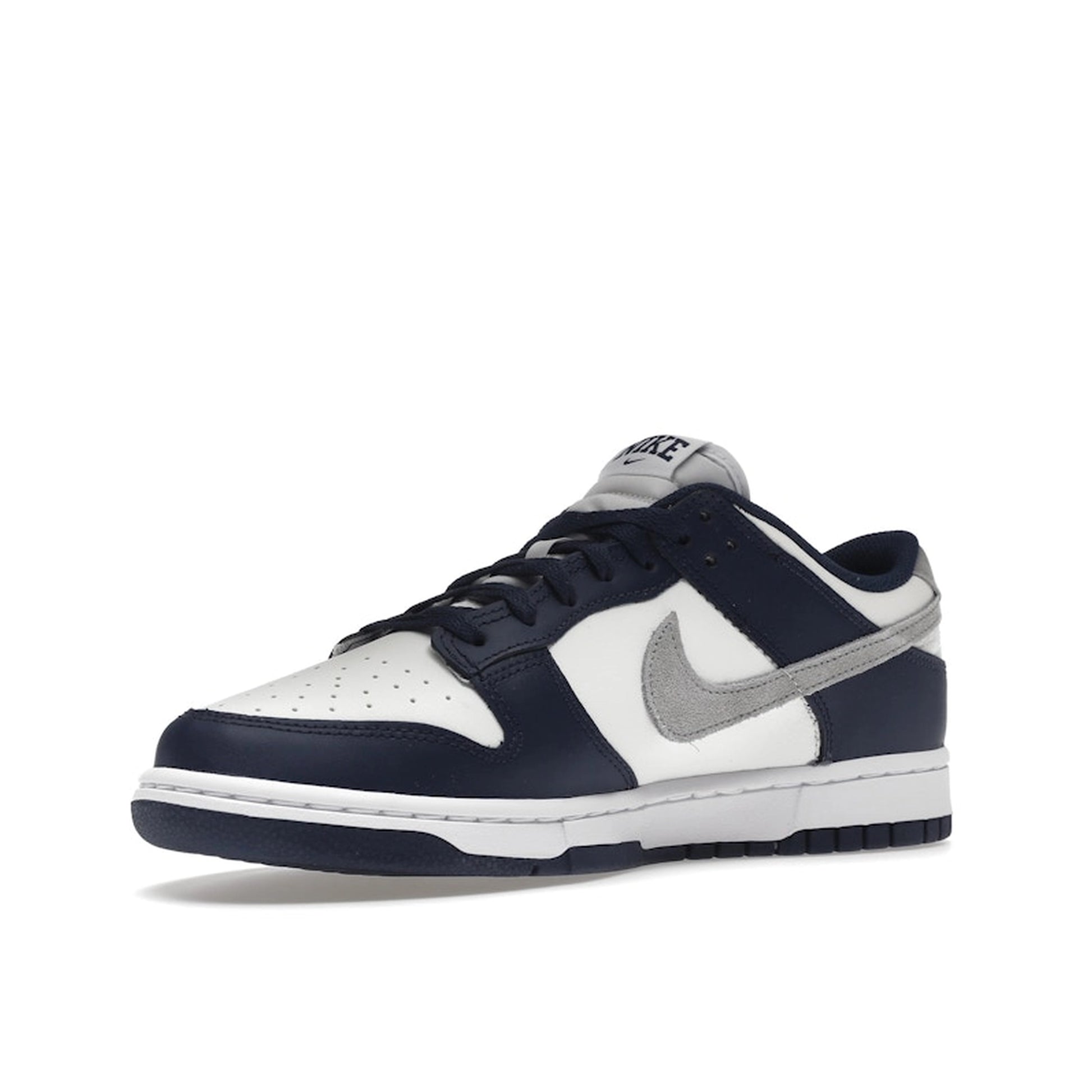 Nike Dunk Low Summit White Midnight Navy sneakers, front view, model FD9749-400 in white with navy accents.