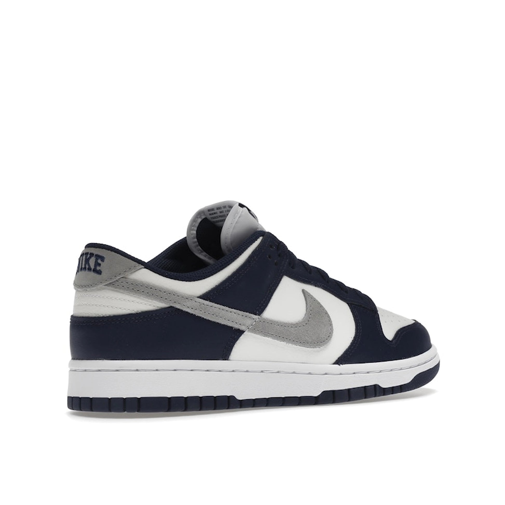 Nike Dunk Low Summit White Midnight Navy sneakers, back view, model FD9749-400 in white with navy accents.