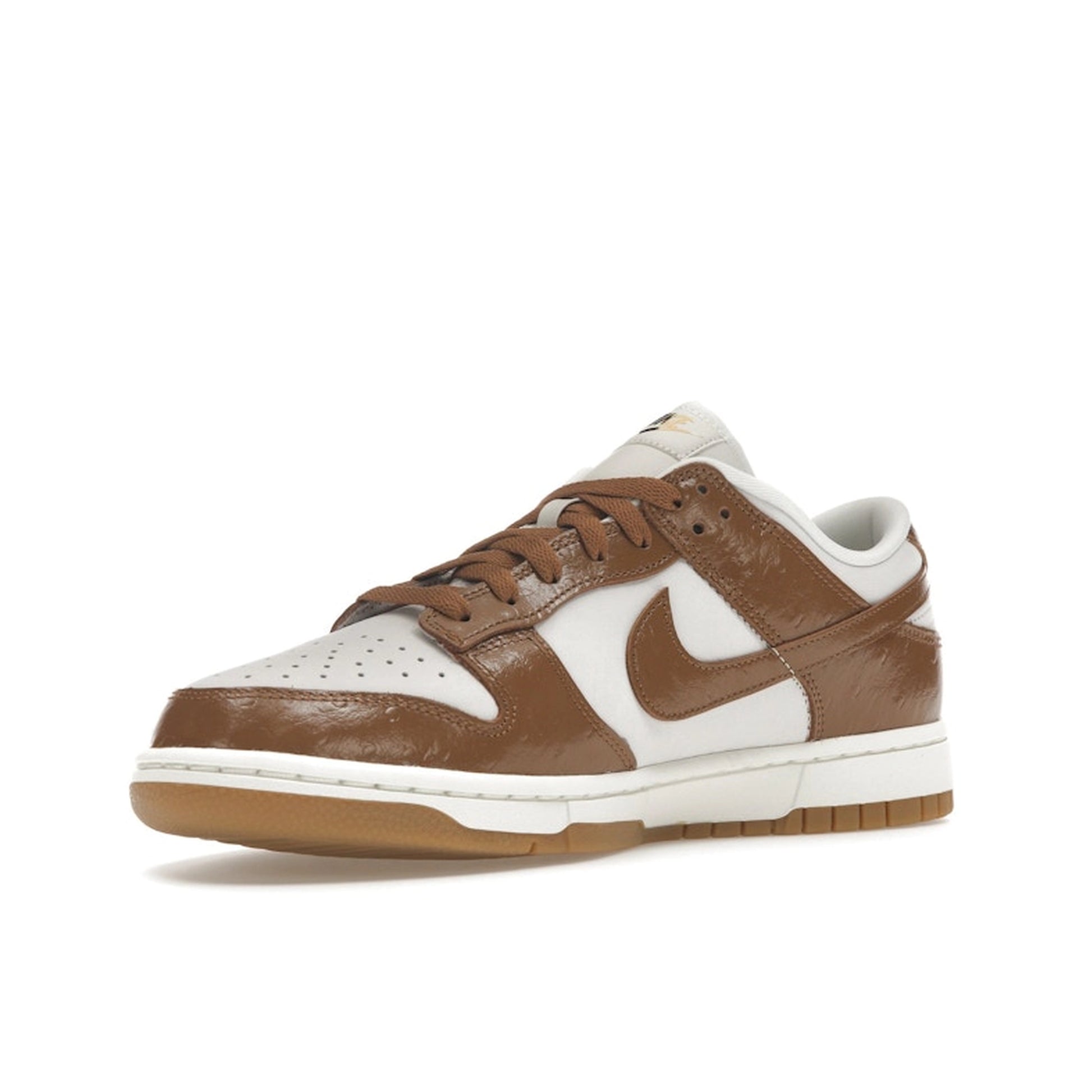 Nike Dunk Low LX Ale Brown Ostrich, front view, in dark brown with embossed leather details.