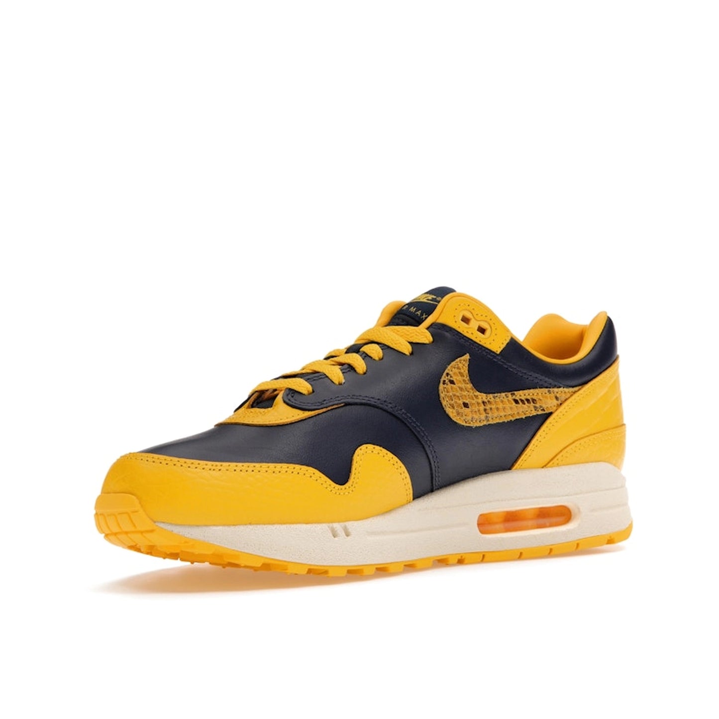 Nike Air Max 1 CO.JP Michigan Women’s sneakers, front view, in navy blue and maize yellow.