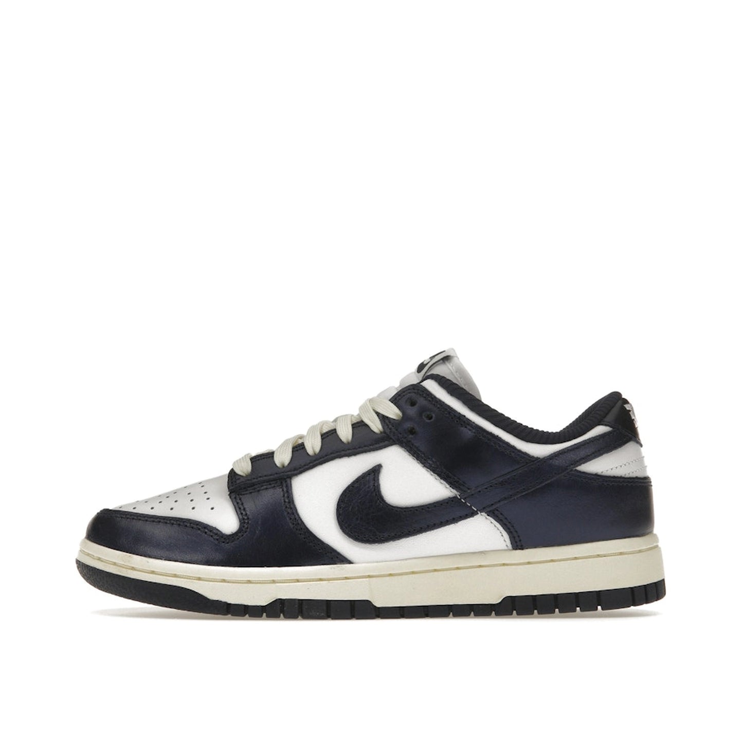 Nike Dunk Low PRM Women's sneakers, side view, model FN7197-100, in vintage navy with white accents.