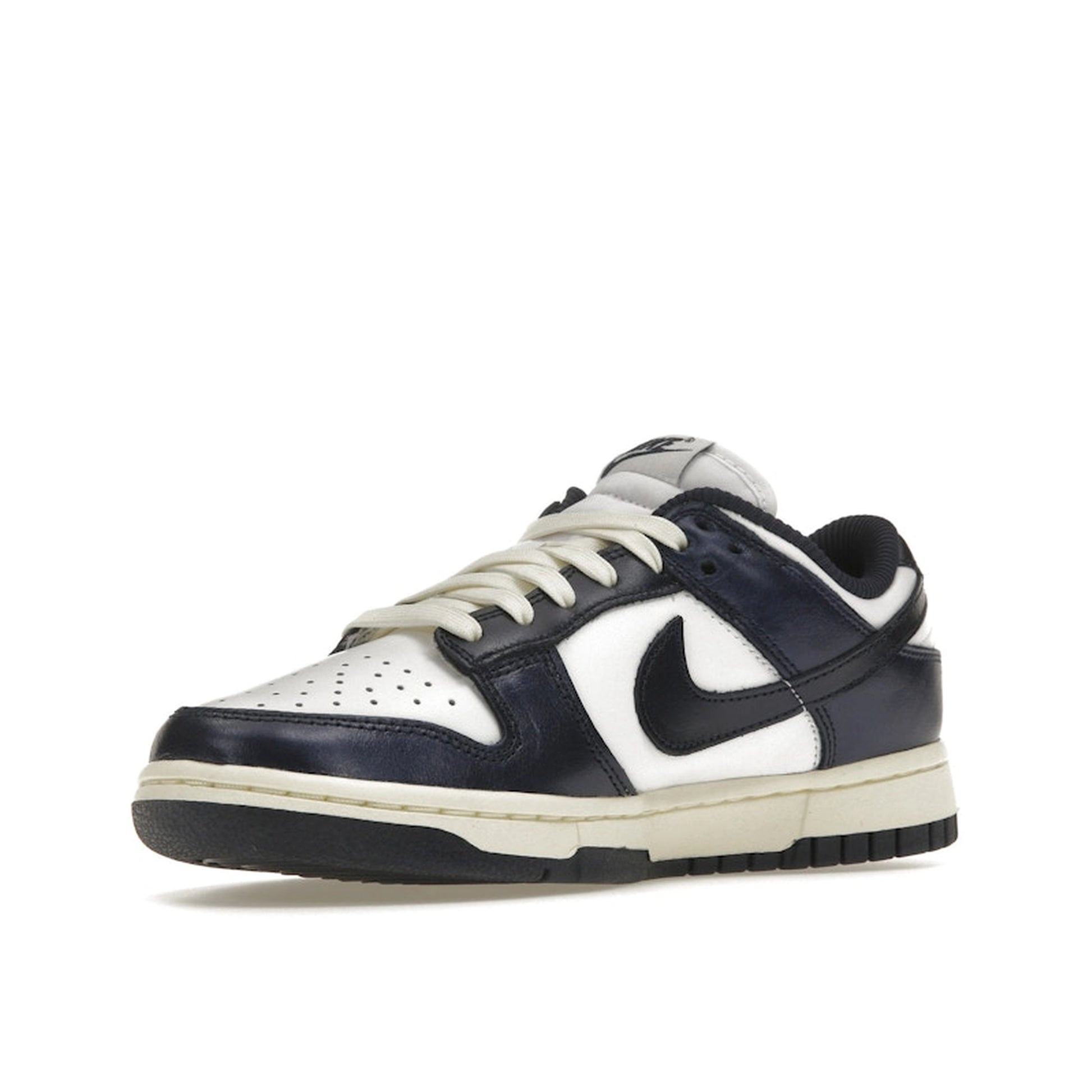 Nike Dunk Low PRM Women's sneakers, front view, model FN7197-100, in vintage navy with white accents.