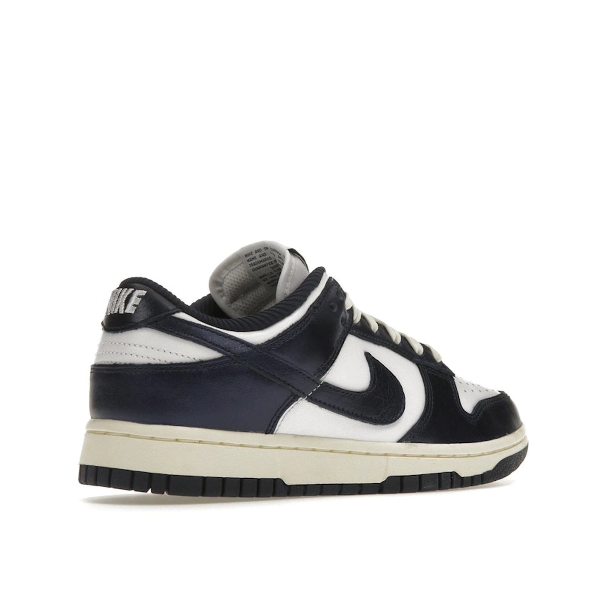 Nike Dunk Low PRM Women's sneakers, back view, model FN7197-100, in vintage navy with white accents.