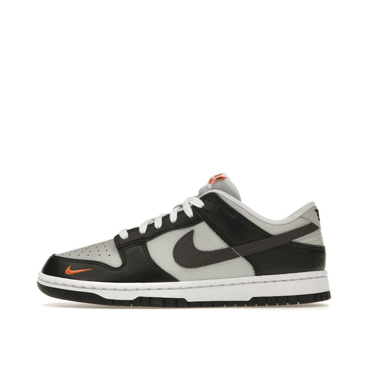 Nike Dunk Low Black Total Orange Mini Swoosh sneakers, side view, model FN7808-001 in black and orange.