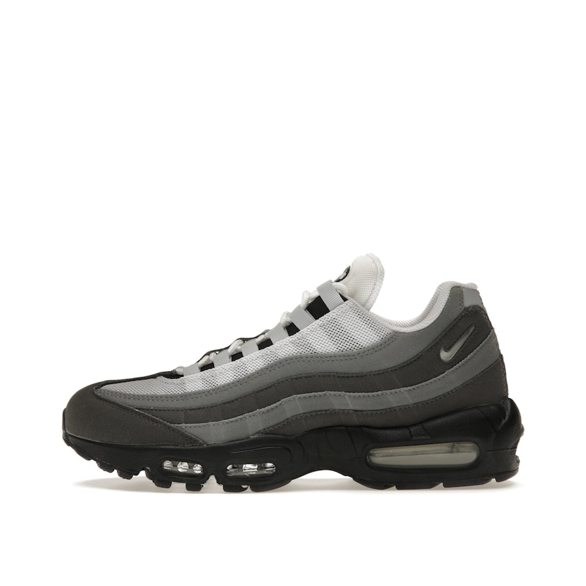 Nike Air Max 95 Jewel Swoosh sneakers, side view, model FQ1235-002, in grey with jewel swoosh detailing.