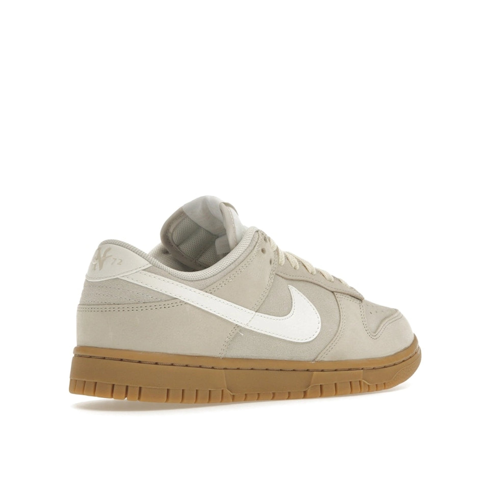 Nike Dunk Low SE Hangul Day Women's sneakers, back view, model FQ8147-104 in beige with gum sole and white details.