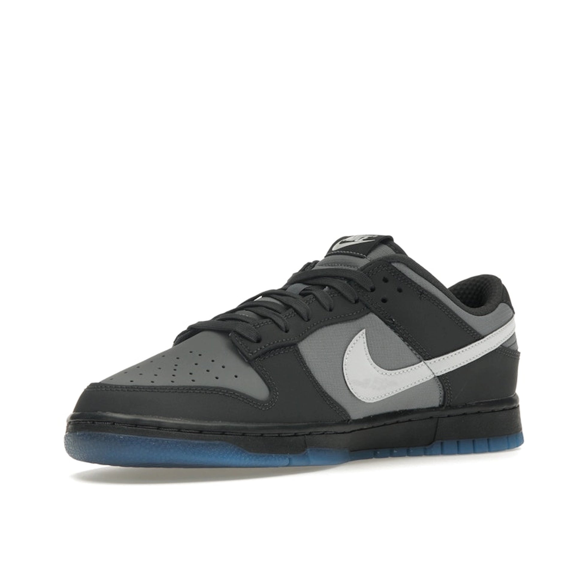 Nike Dunk Low sneakers, front view, model FV0384-001 in anthracite with black and grey details.