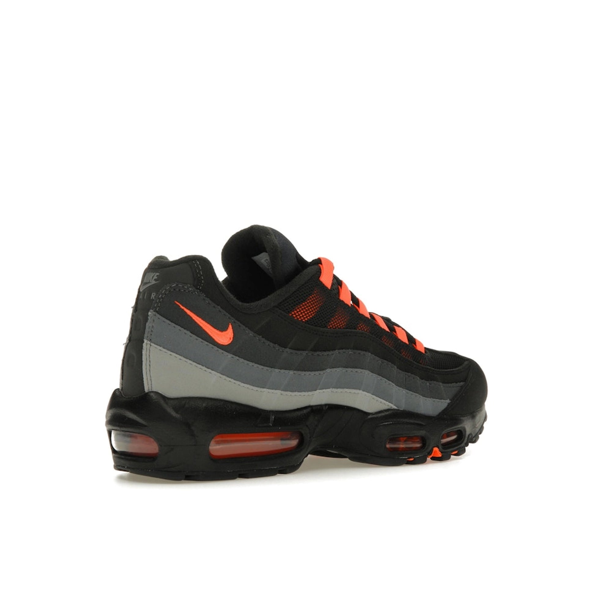 Nike Air Max 95 Black Hyper Crimson, back view, in mesh and suede with orange-red highlights.