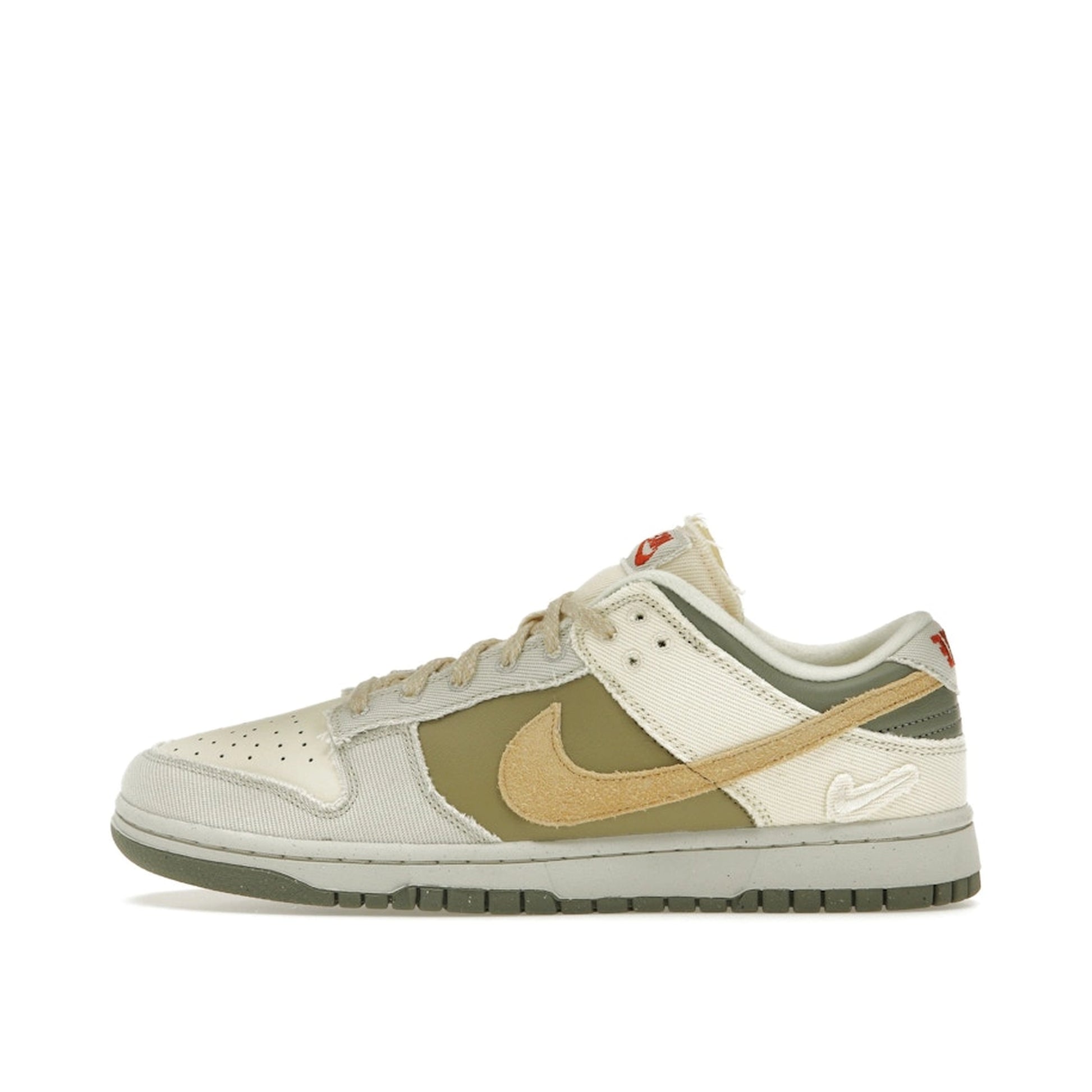 Nike Dunk Low Women's sneakers, side view, model FZ4341-100, in light bone with dark stucco and white accents.