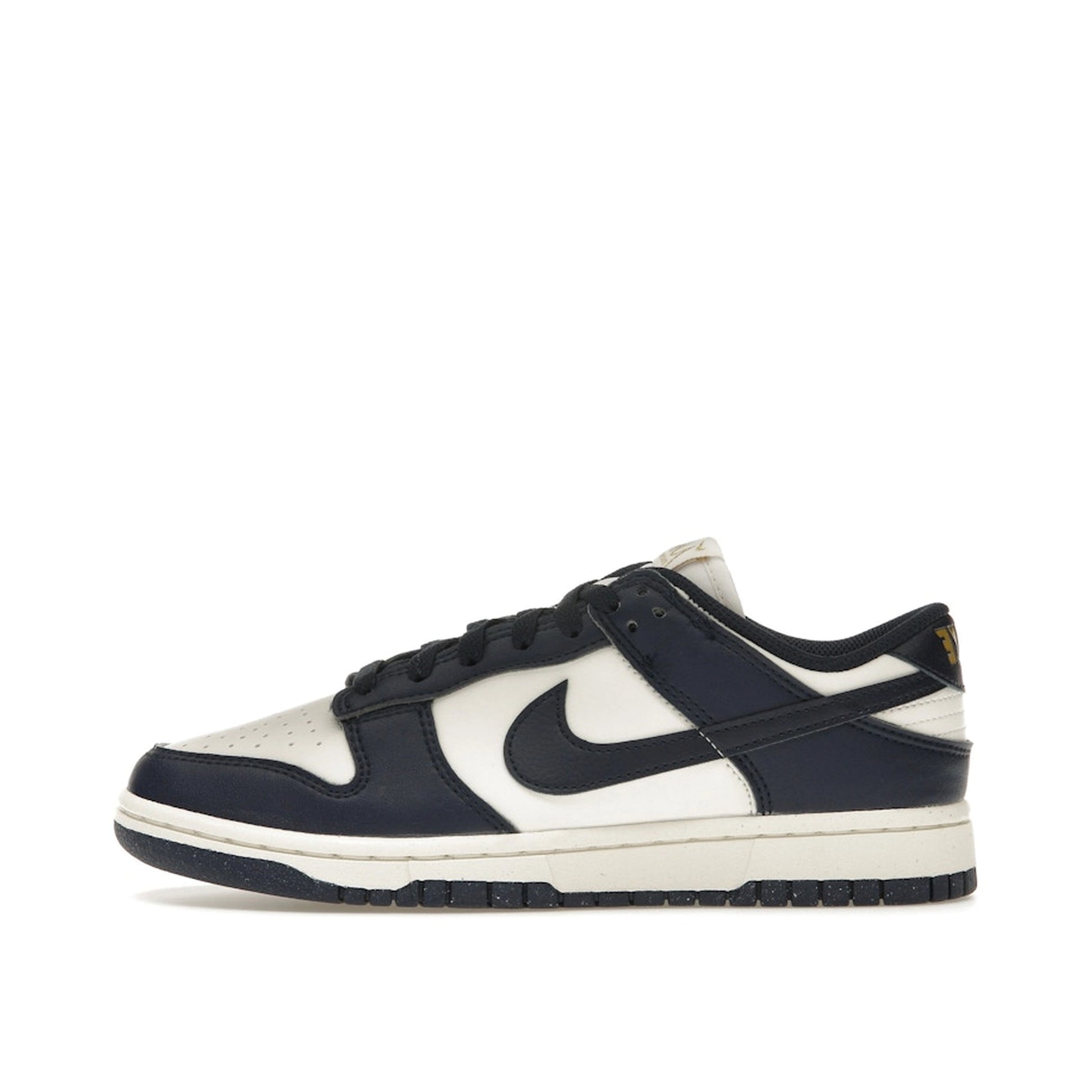 Nike Dunk Low Next Nature Women’s sneakers, side view, in Olympic-inspired dark blue and gold.