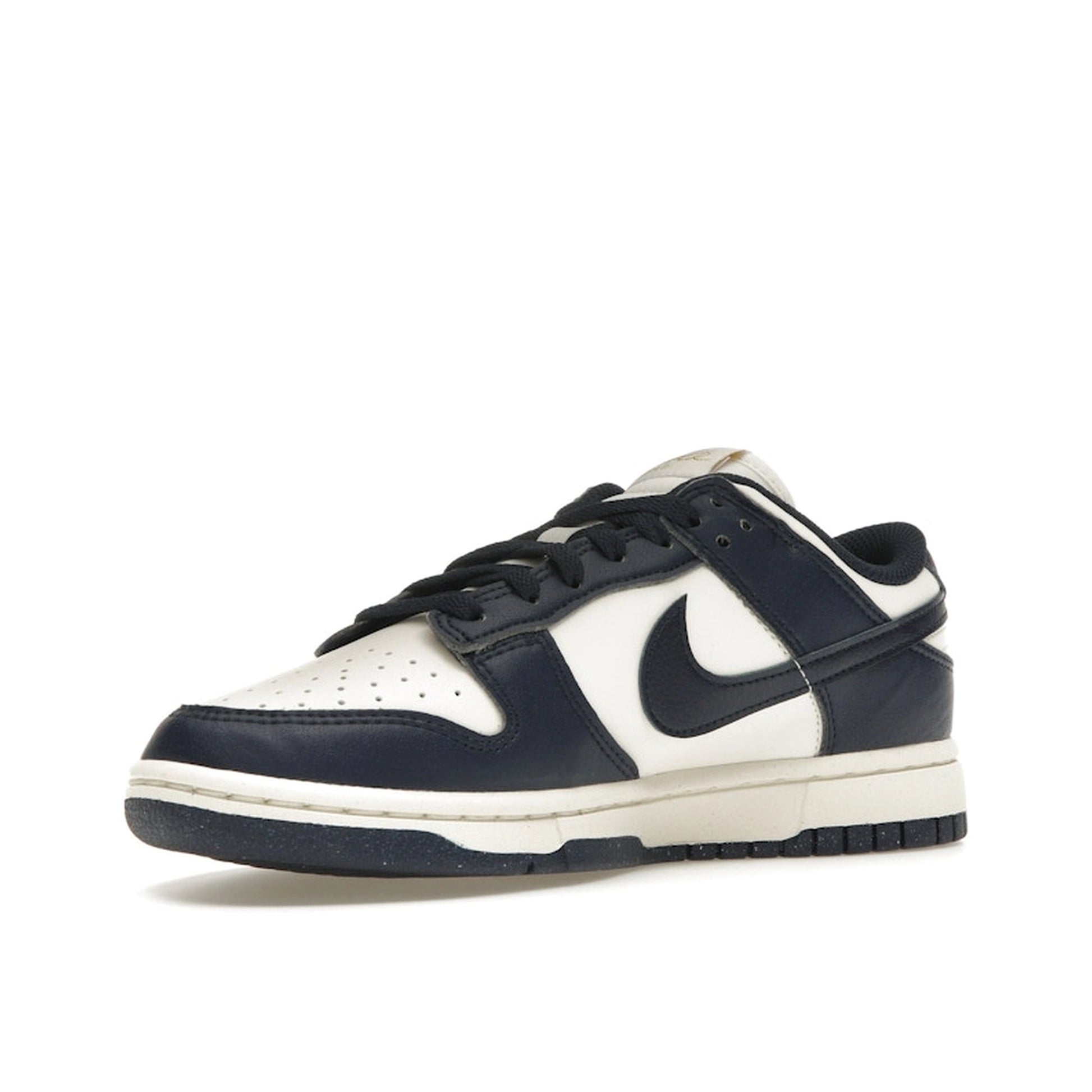 Nike Dunk Low Next Nature Women’s sneakers, front view, in Olympic-inspired dark blue and gold.