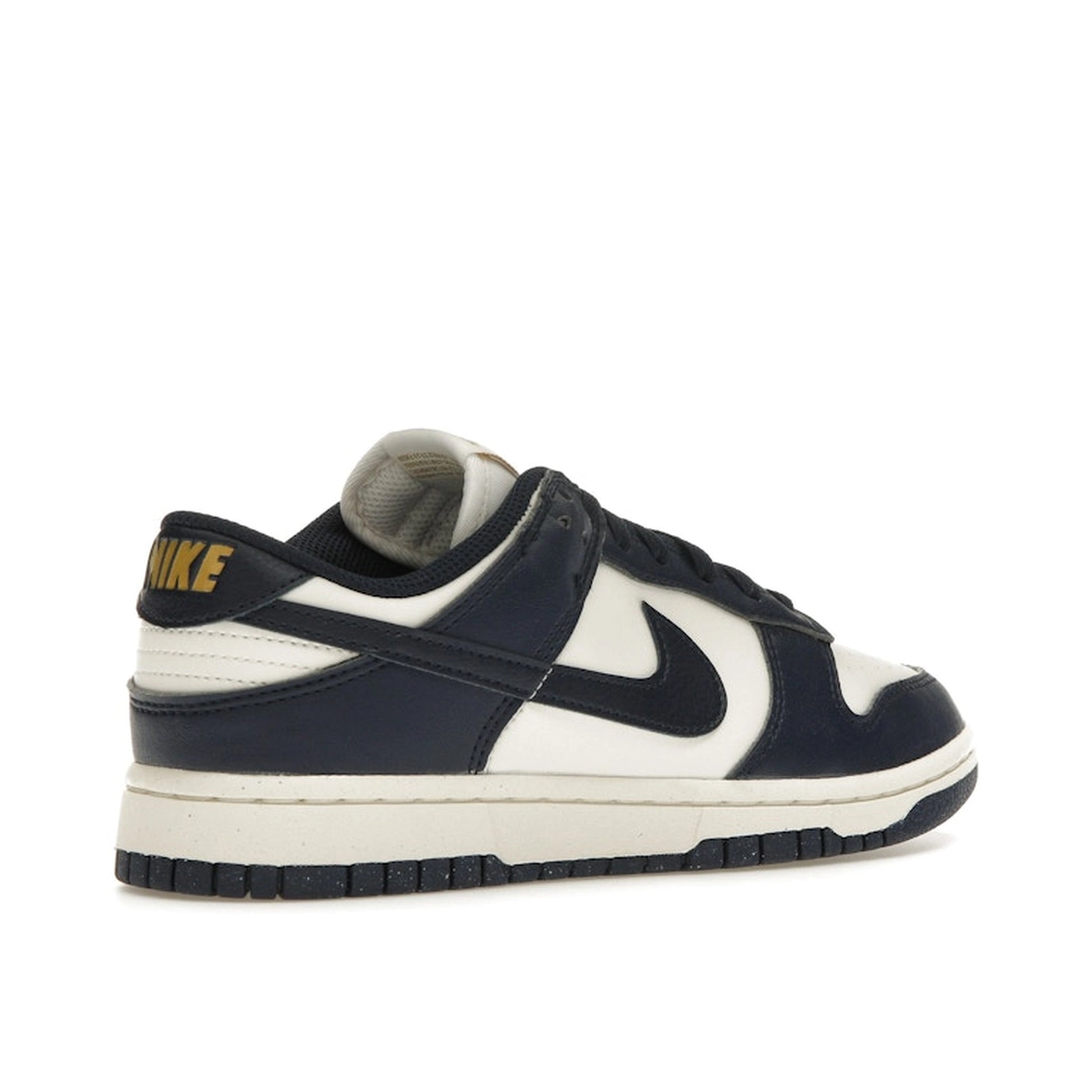 Nike Dunk Low Next Nature Women’s sneakers, back view, in Olympic-inspired dark blue and gold.