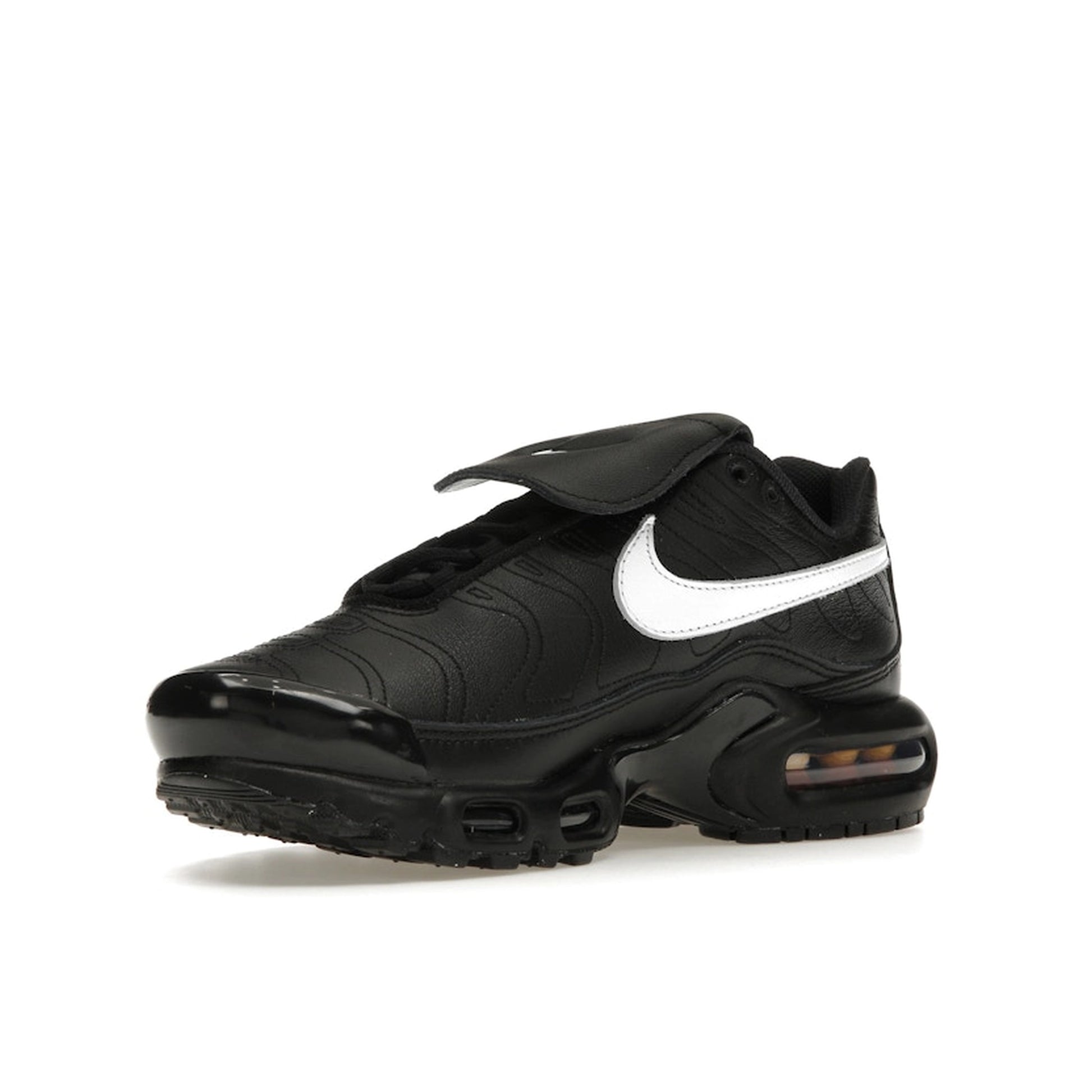 Nike Air Max Plus Tiempo, front view, in black leather with white swoosh and sole.