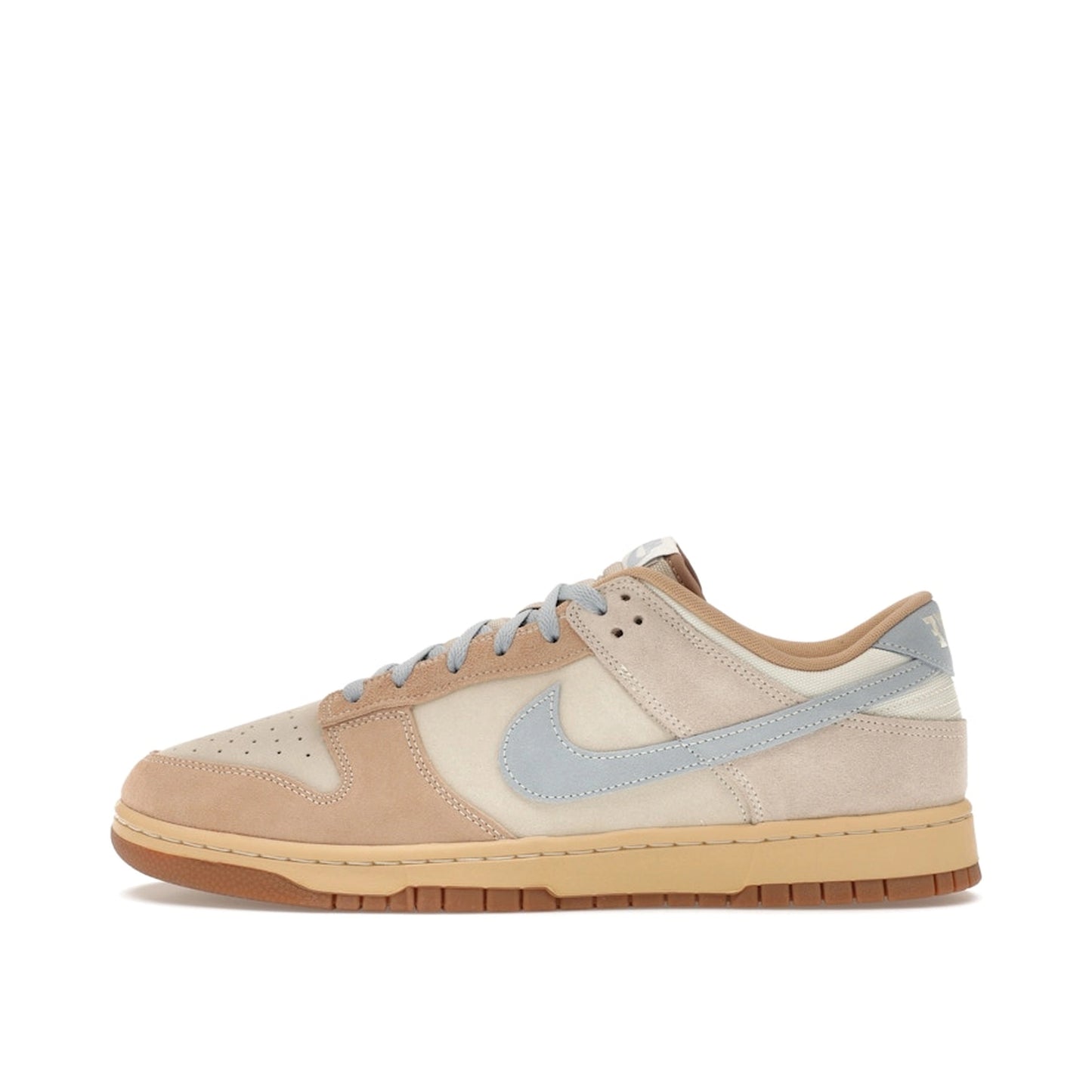 Nike Dunk Low Sanddrift sneakers, side view, model HF0106-100, in light armory blue with sanddrift and white accents.