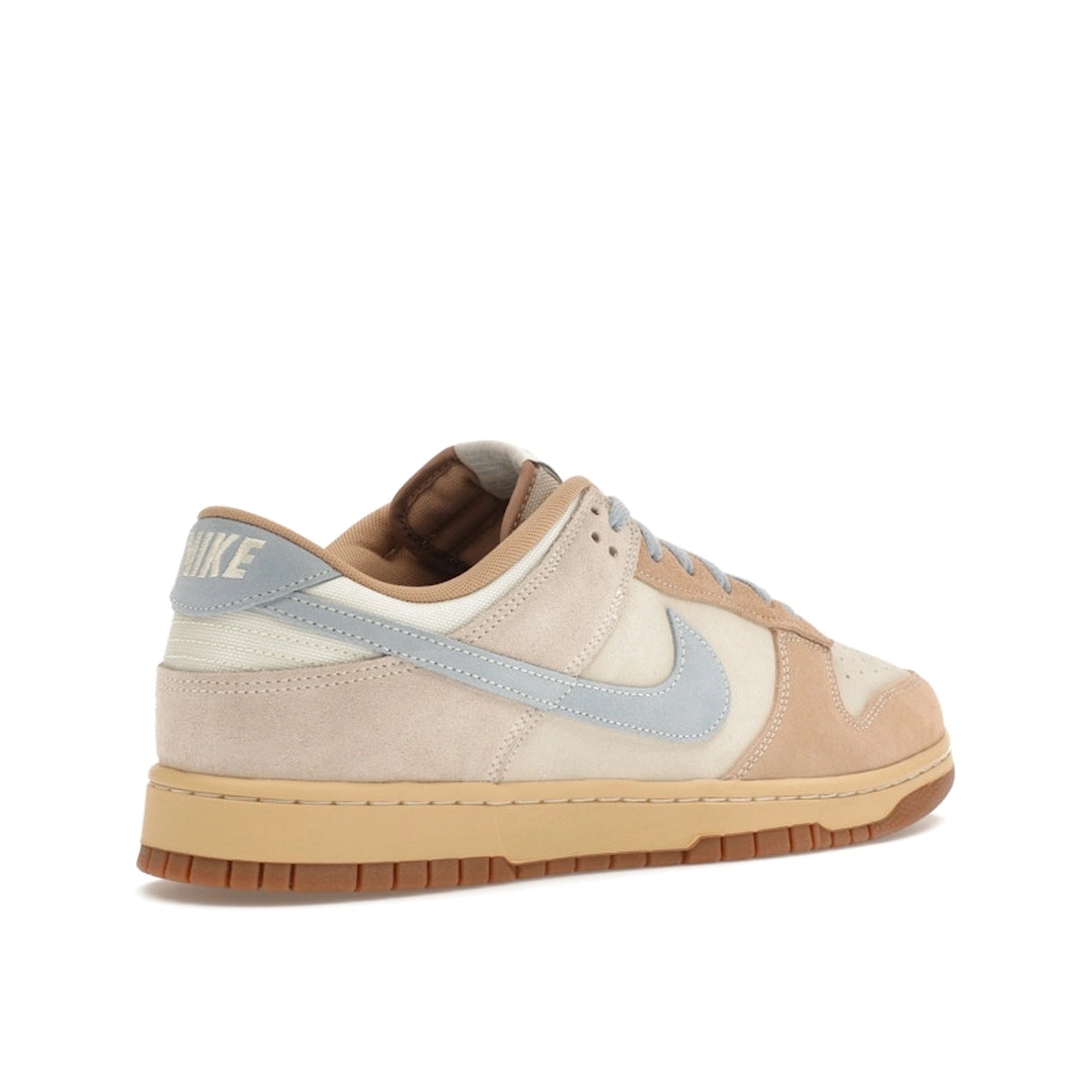 Nike Dunk Low Sanddrift sneakers, back view, model HF0106-100, in light armory blue with sanddrift and white accents.