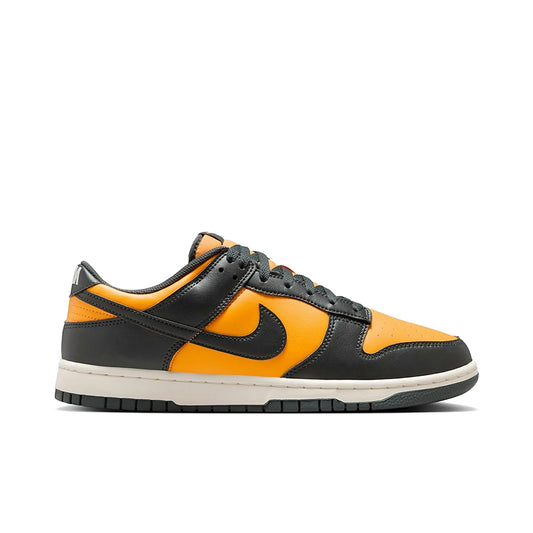 Nike Dunk Low Retro in dark anthracite with orange sundial accents, low-top silhouette