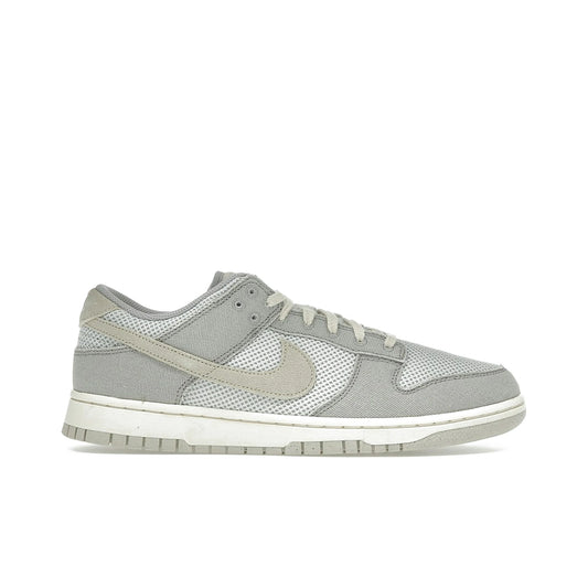 Nike Dunk Low Retro SE men's leather sneaker in College Grey, Light Bone, Pale Ivory and Pearl White