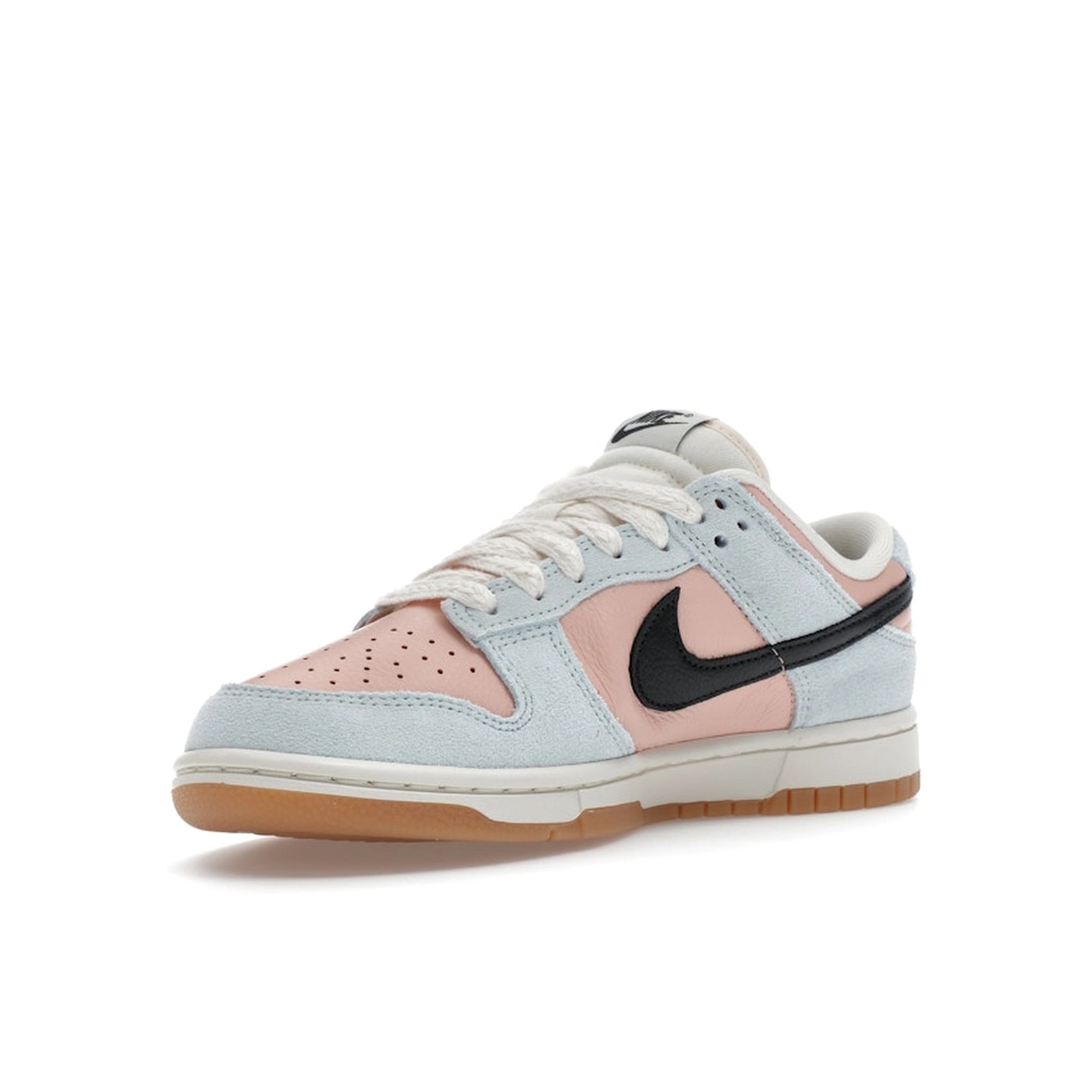 Nike Dunk Low Women’s sneakers, front view, in glacier blue with arctic orange accents.