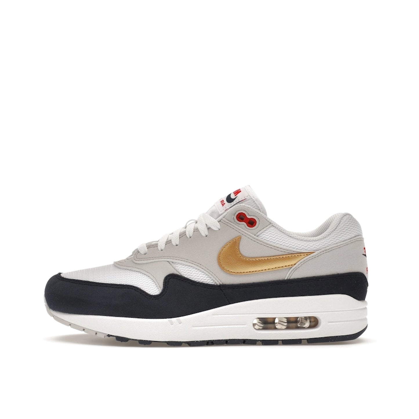 Nike Air Max 1 sneakers, side view, in blue, red, and white Olympic-inspired colors.