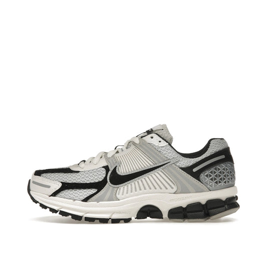 Nike Zoom Vomero 5 Women's sneakers, side view, in photon dust and black.