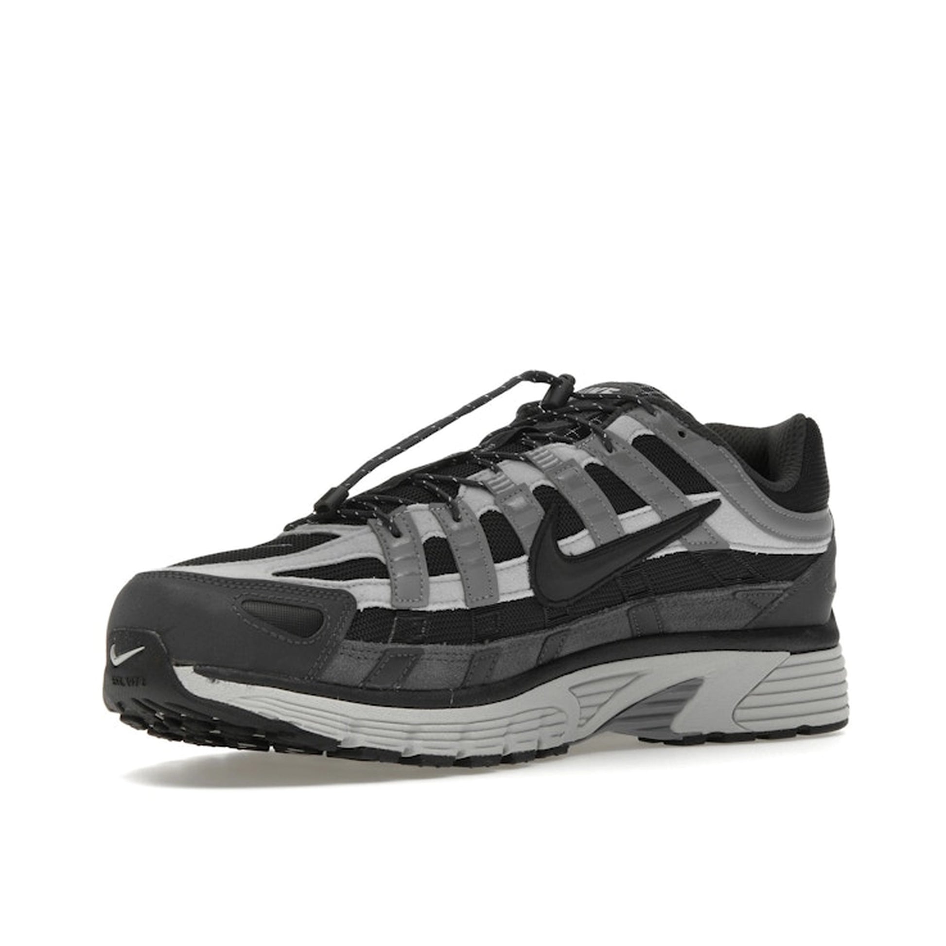 Nike P-6000, front view, in dark anthracite and smoke grey tones.