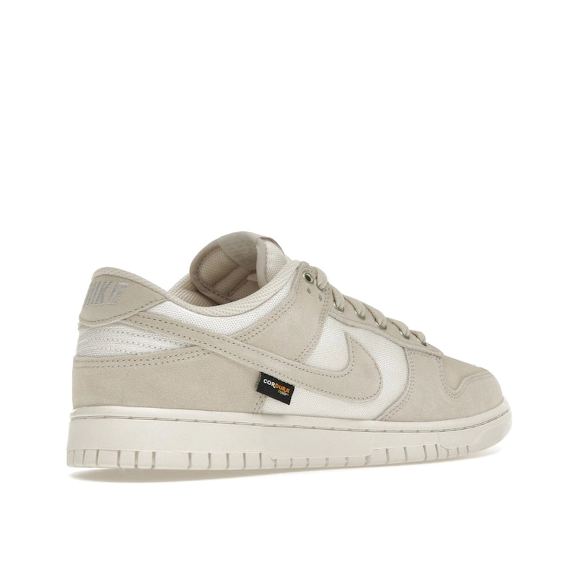 Nike Dunk Low sneakers, back view, in light orewood brown with Cordura fabric construction.