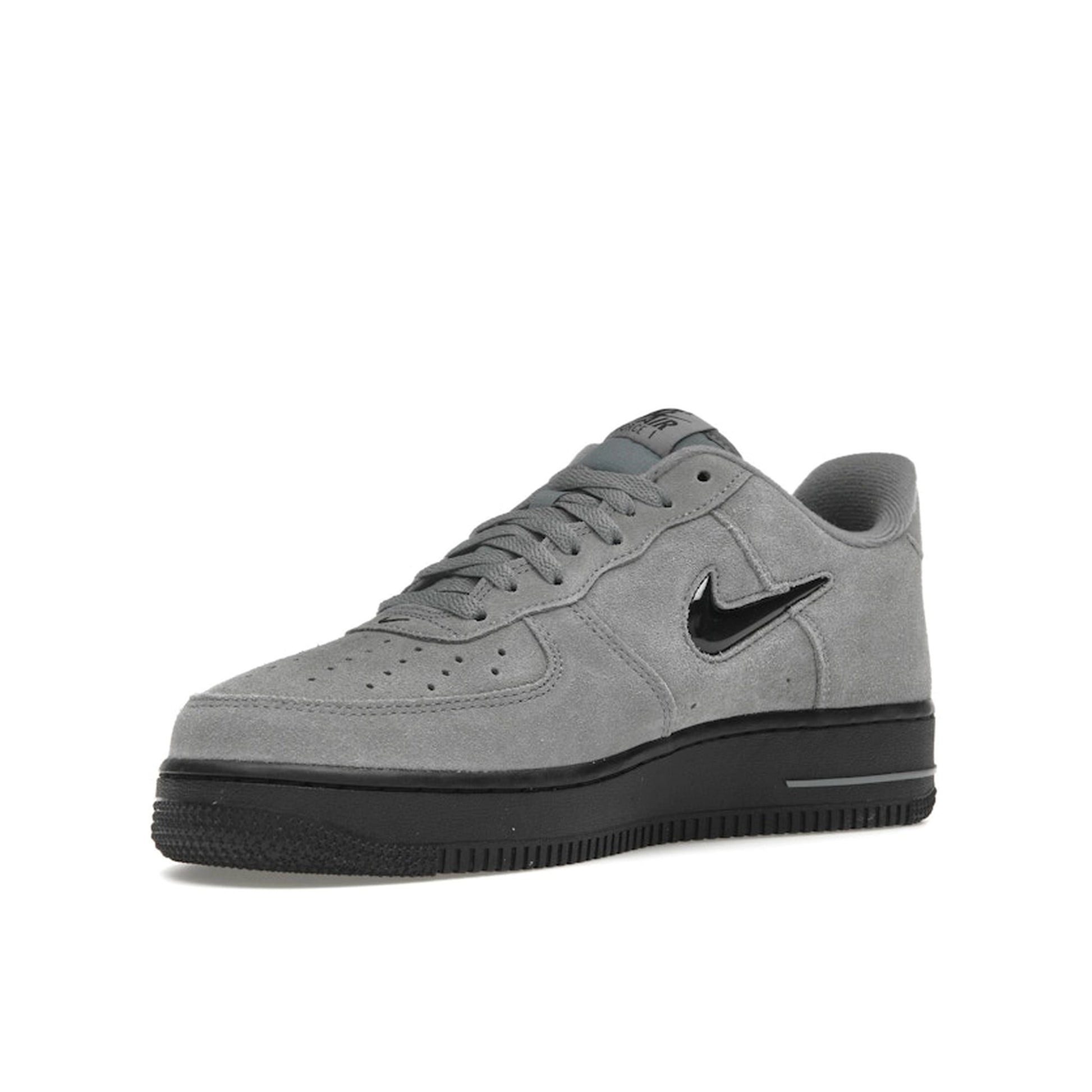 Nike Air Force 1 ’07 Low Jewel sneakers, front view, in cool grey with black swoosh.