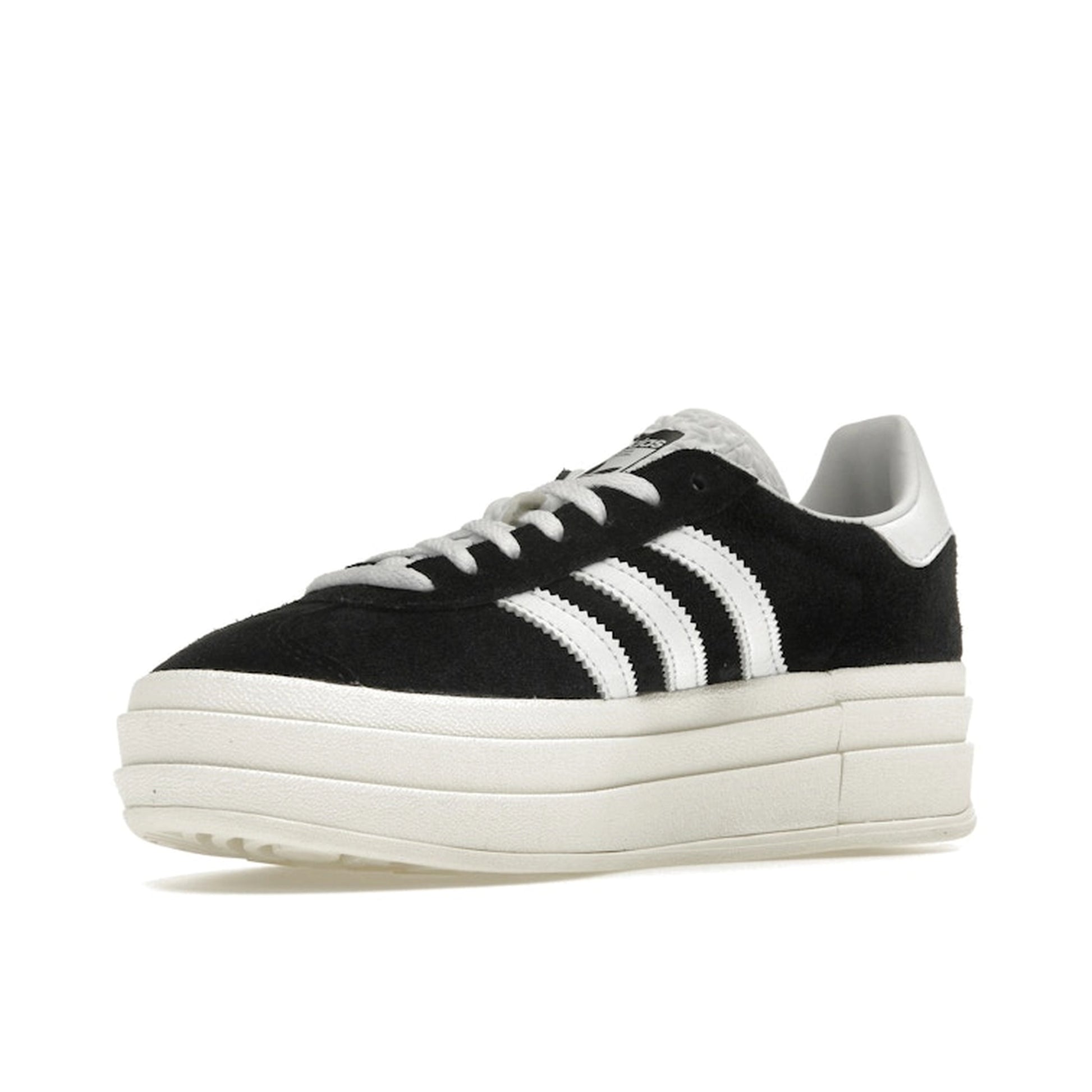 adidas Gazelle Bold Women’s sneakers, front view, in core black with cloud white stripes and platform sole.