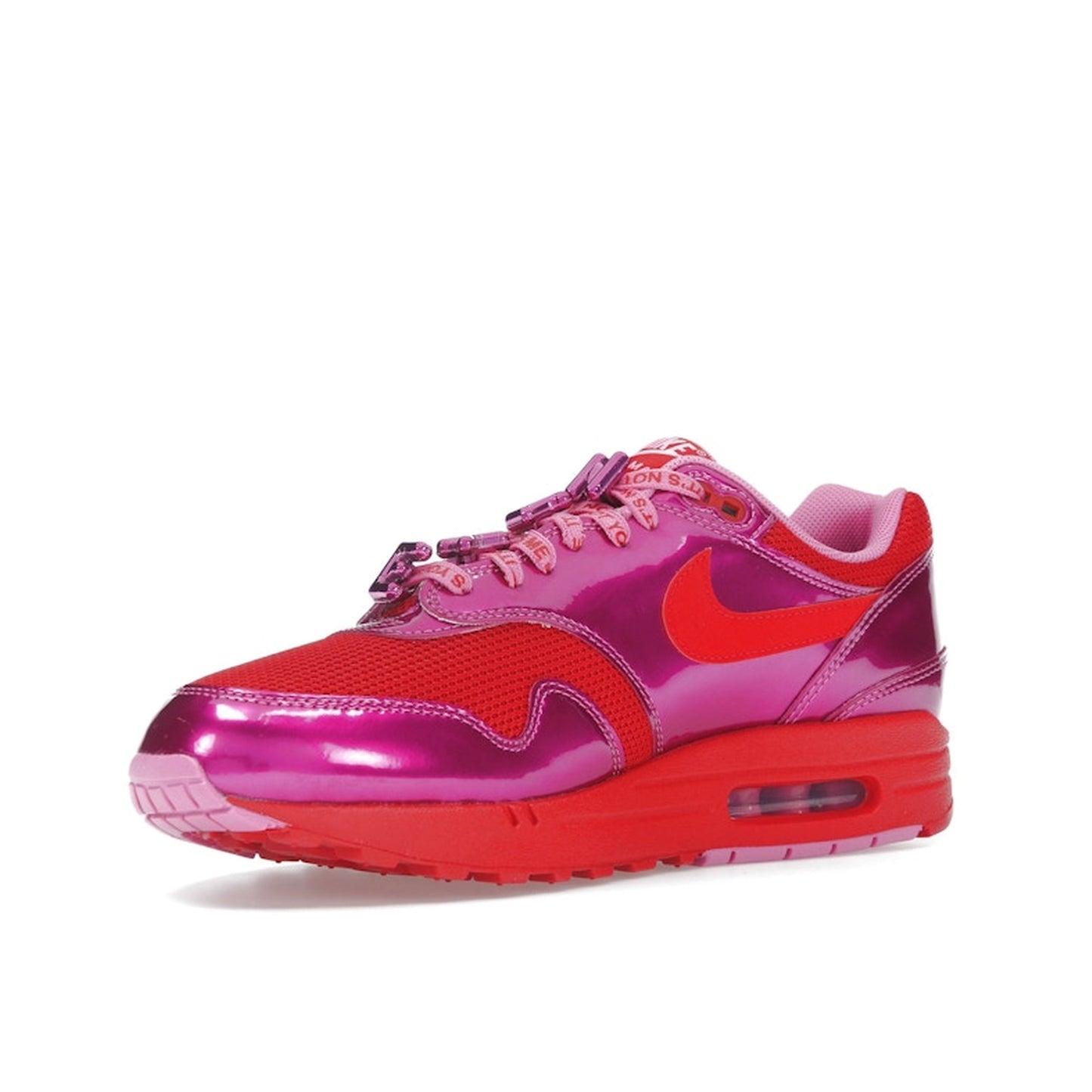 Nike Air Max 1 PRM sneakers, top view, in playful pink with white and heart-inspired accents.