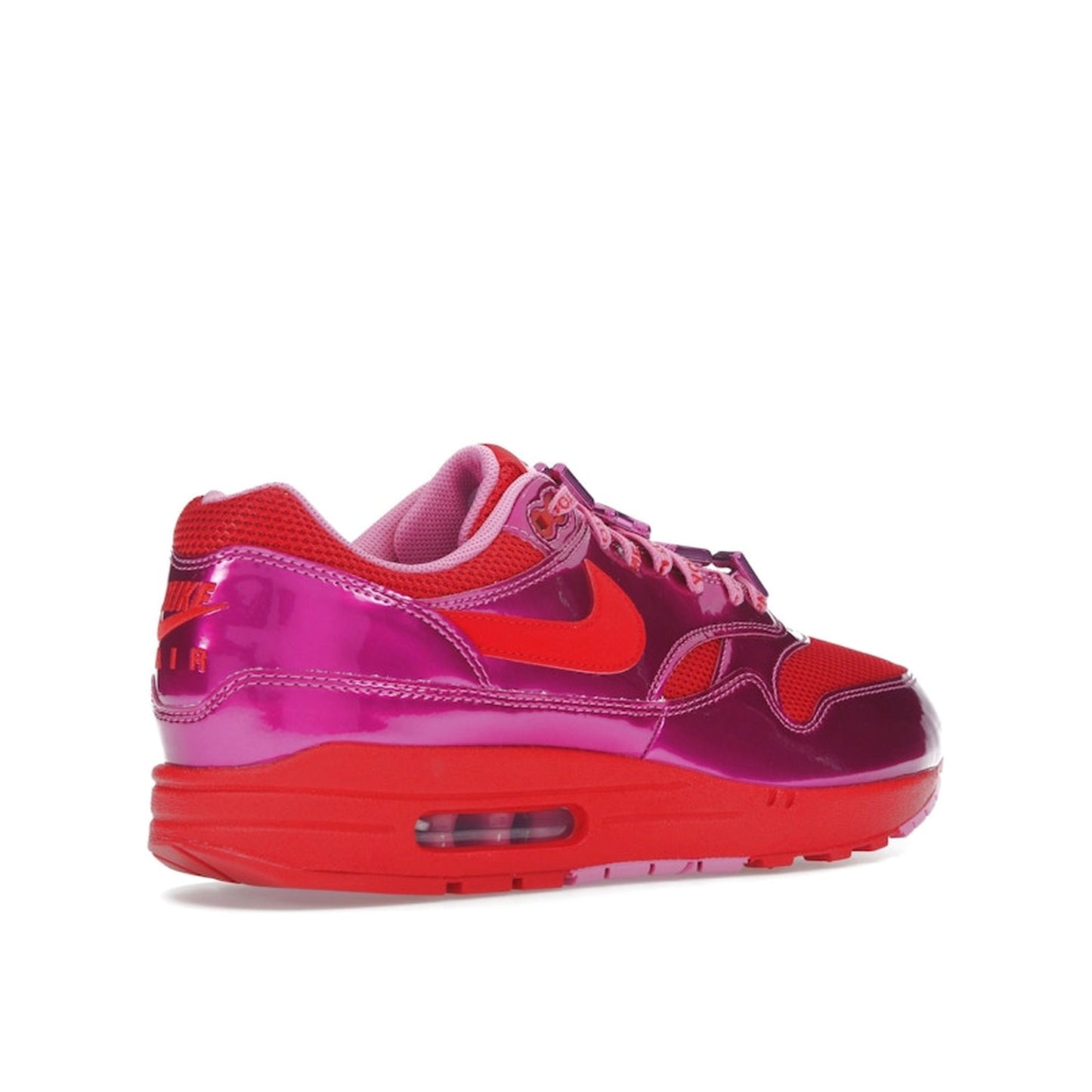 Nike Air Max 1 PRM sneakers, top view, in playful pink with white and heart-inspired accents.