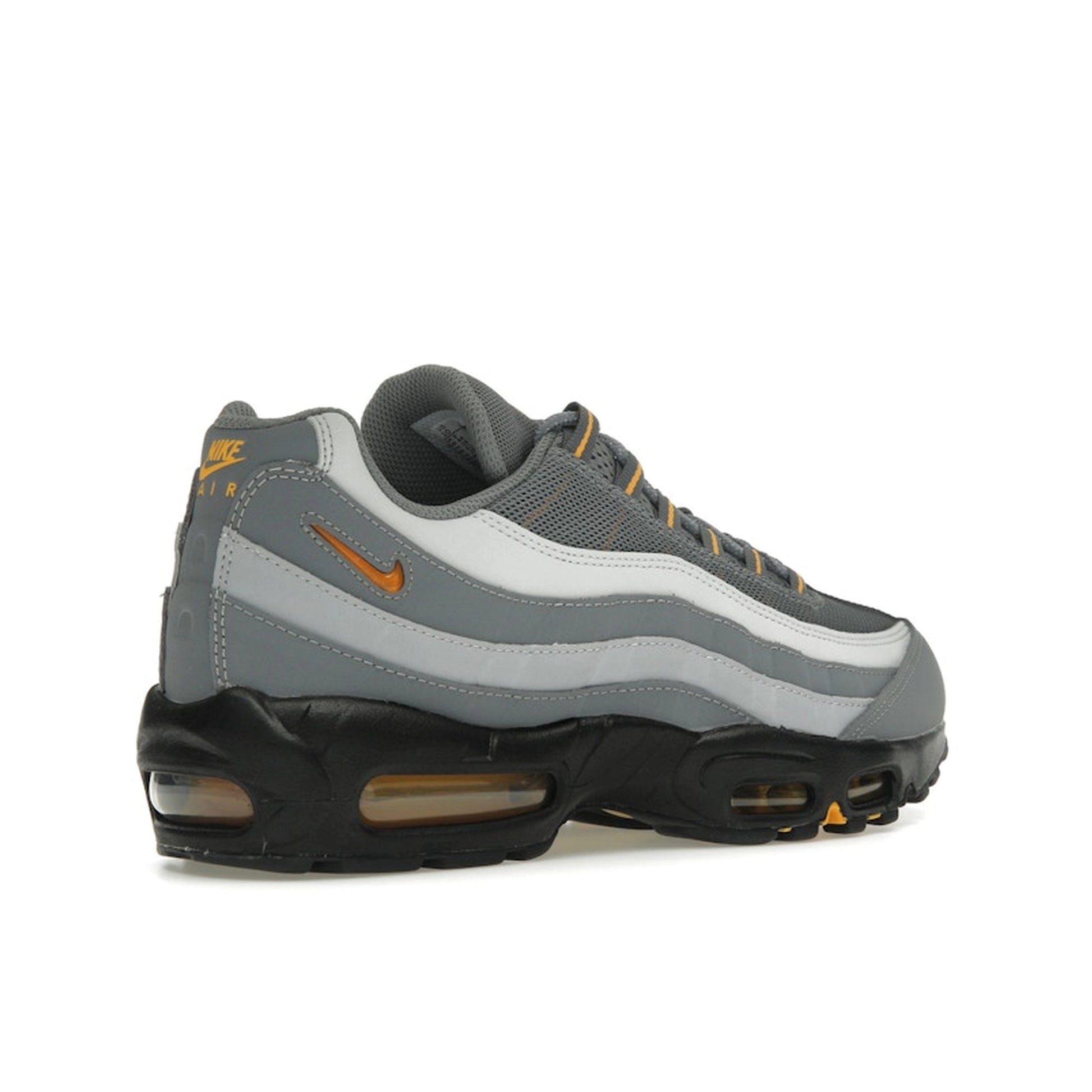 Nike Air Max 95 Cool Grey Sundial, back view, in layered grey tones with vibrant yellow accents.
