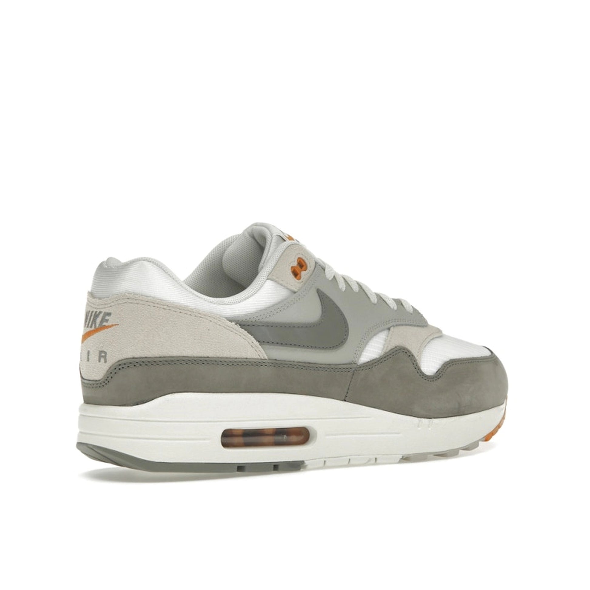 Nike Air Max 1 Light Iron Ore, back view, featuring mesh base and grey suede panels.