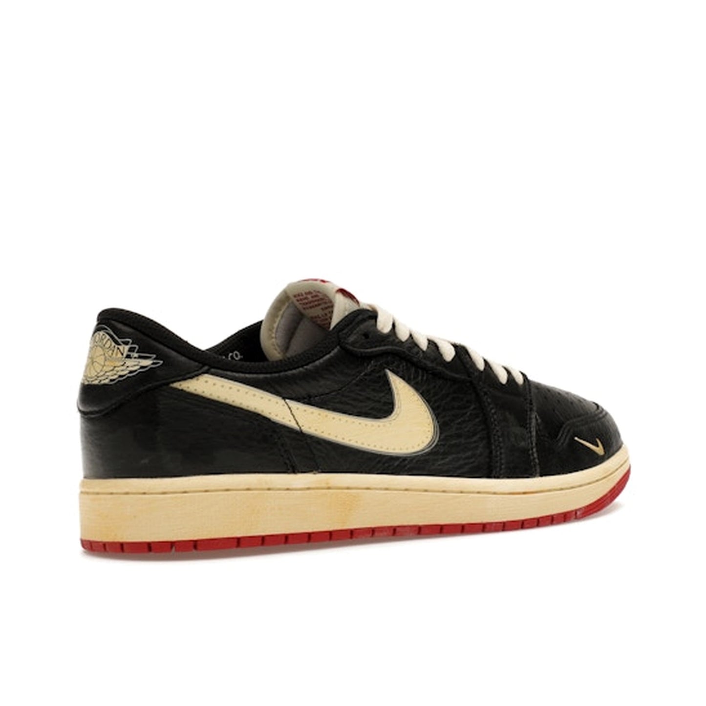 Jordan 1 Retro Low OG Nigel Sylvester, back view, distressed black upper with aged details.