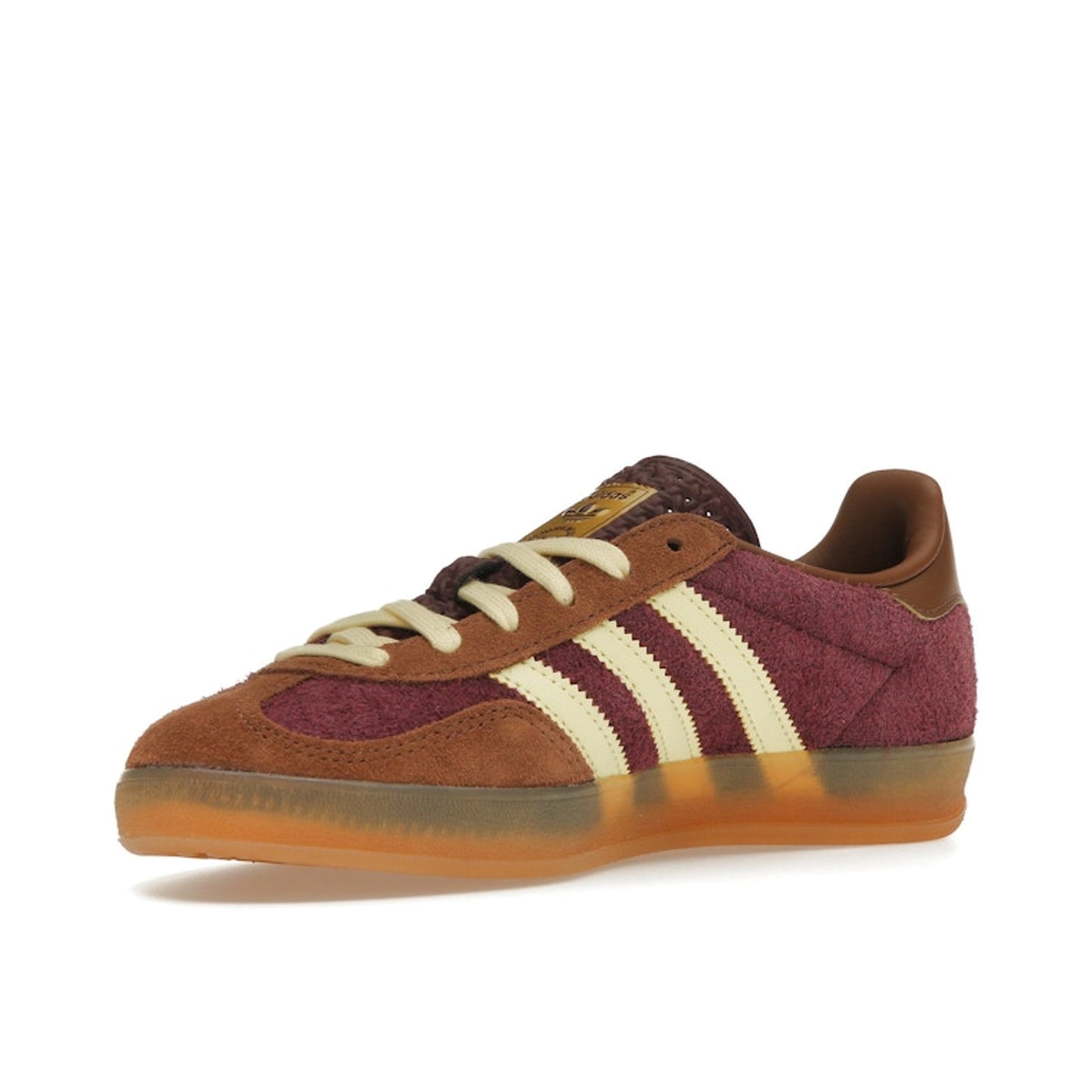 Adidas Gazelle Indoor sneakers, front view, model JI0324, in maroon with almost yellow accents.